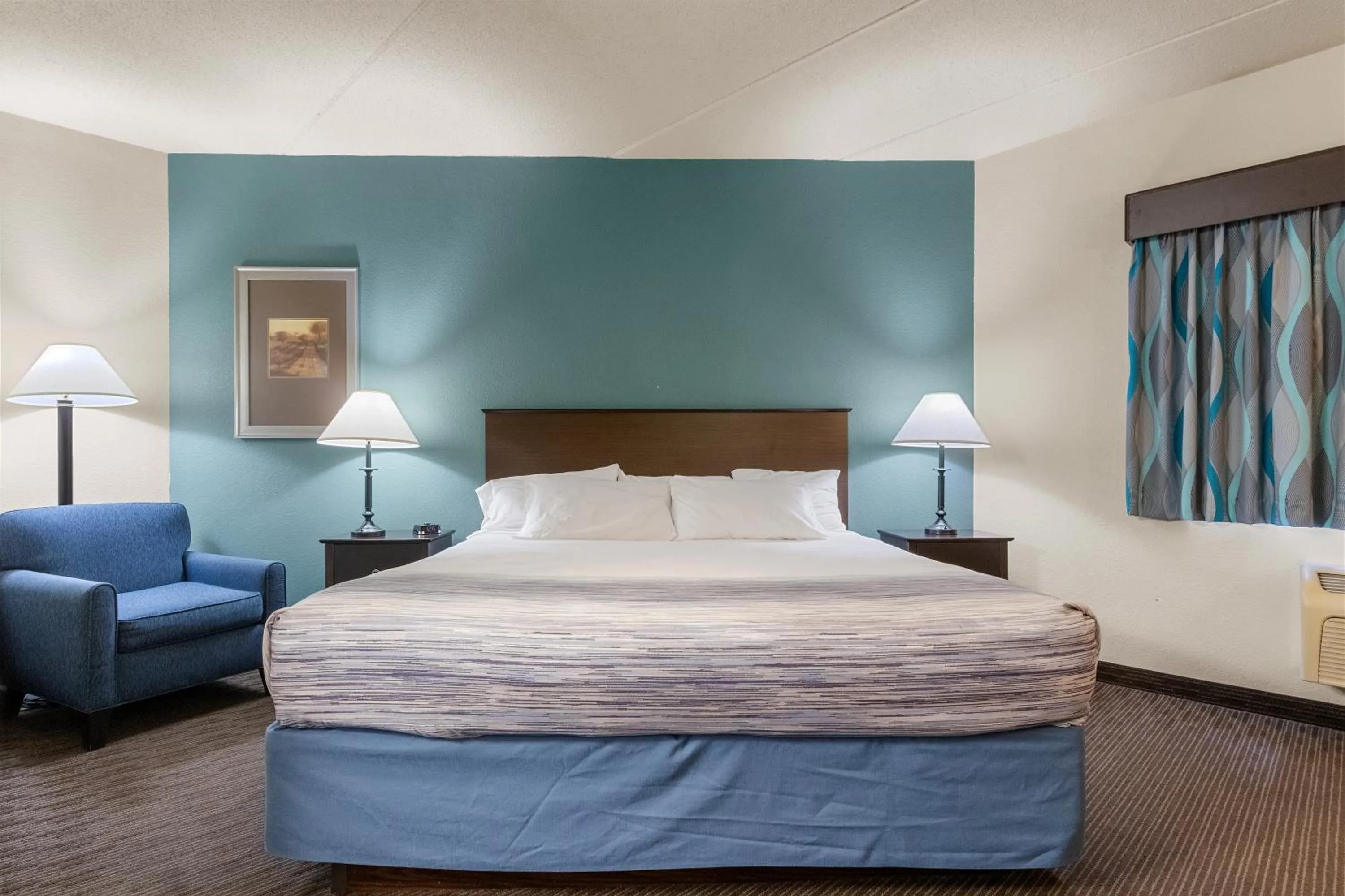 Bed in AmericInn by Wyndham Green Bay East