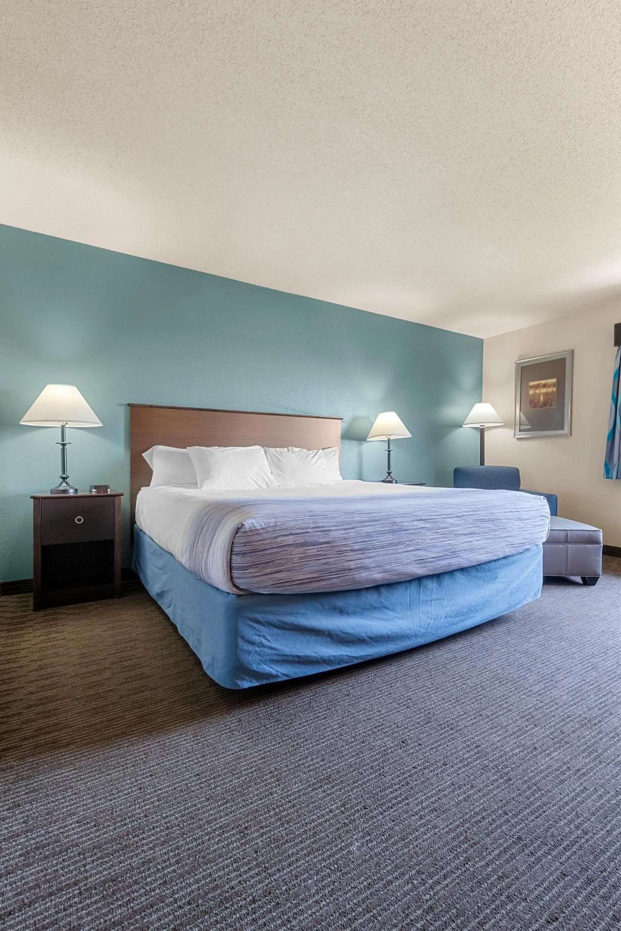 Bed in AmericInn by Wyndham Green Bay East