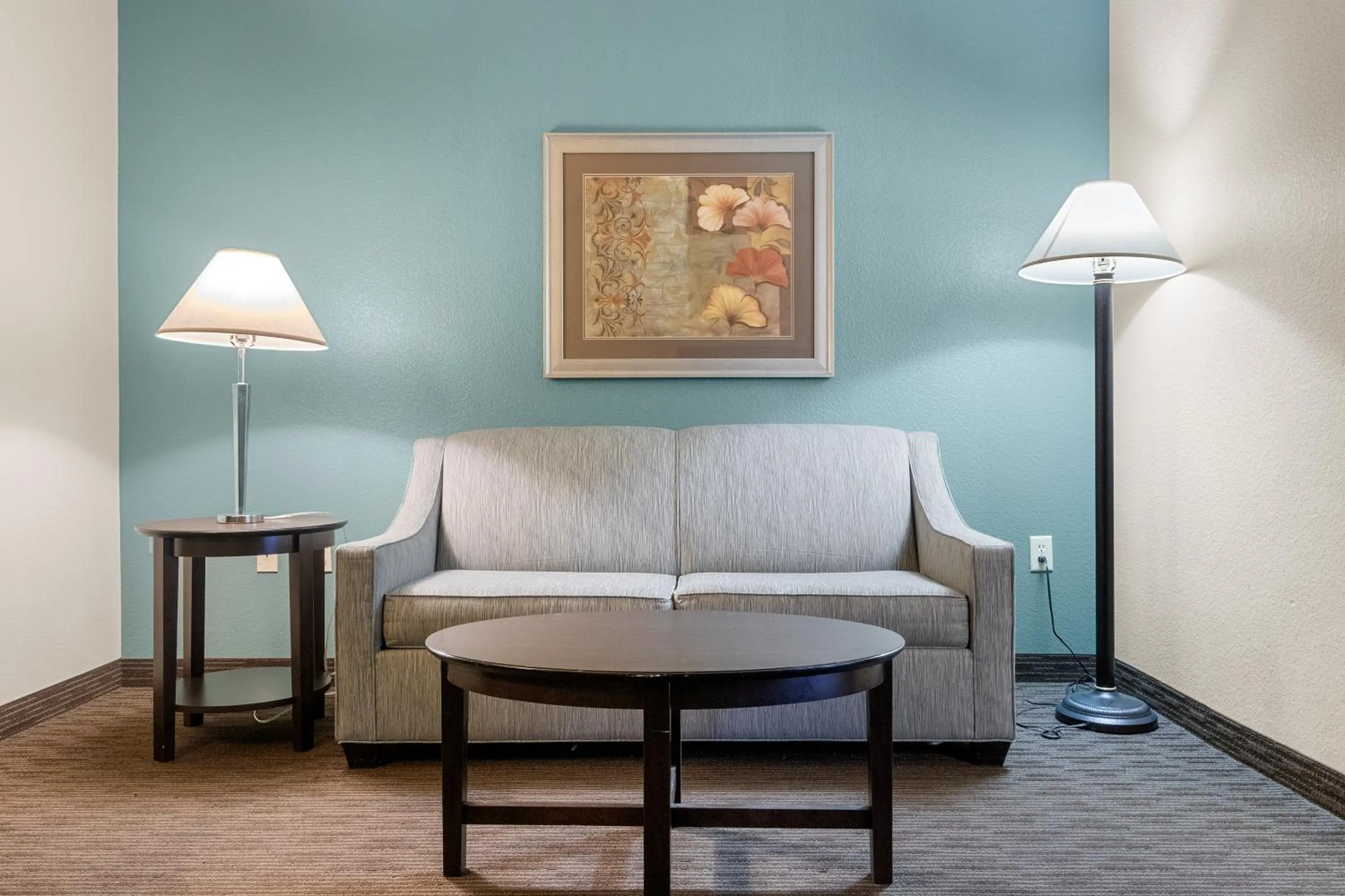 Living room in AmericInn by Wyndham Green Bay East