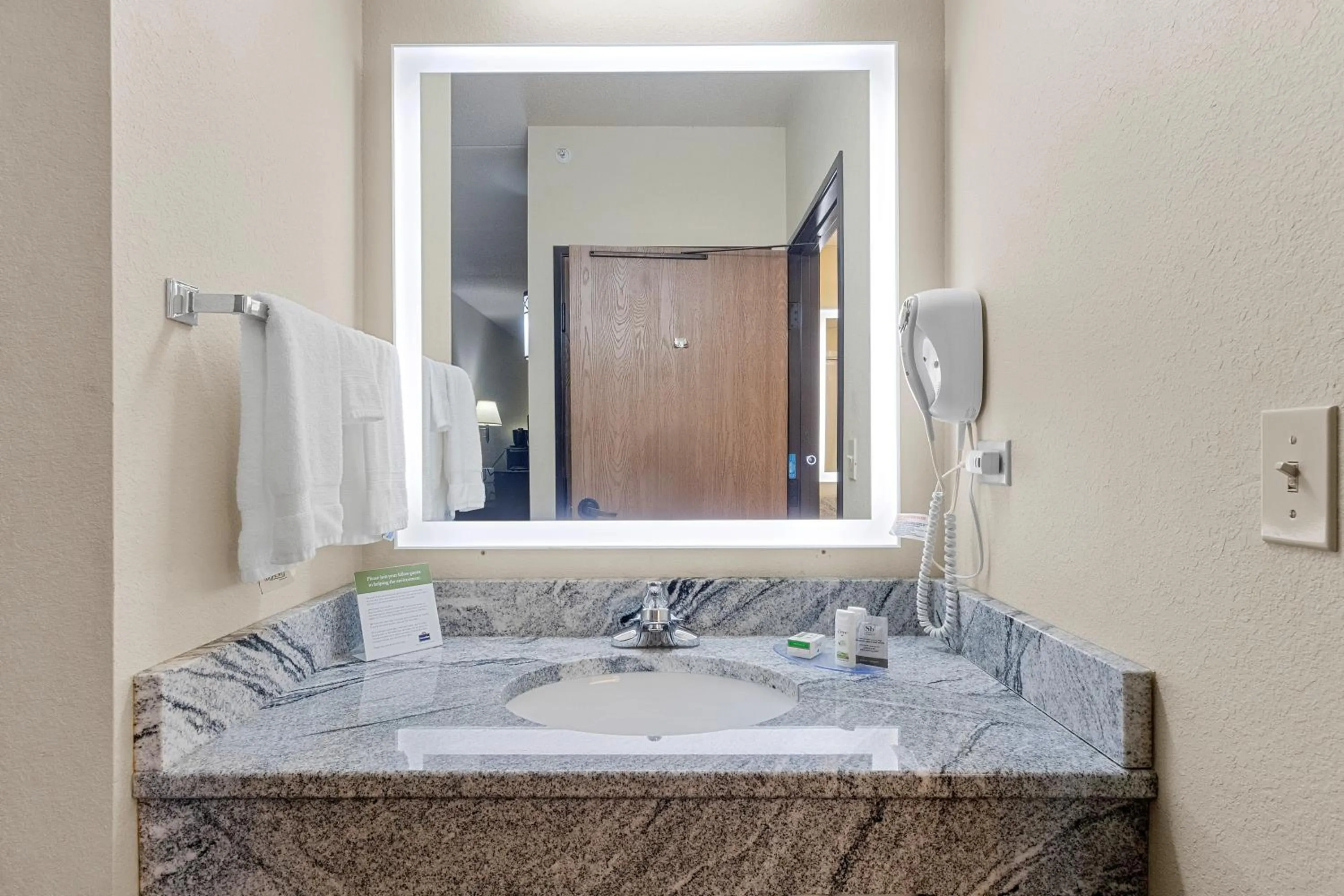 Bathroom in AmericInn by Wyndham Green Bay East