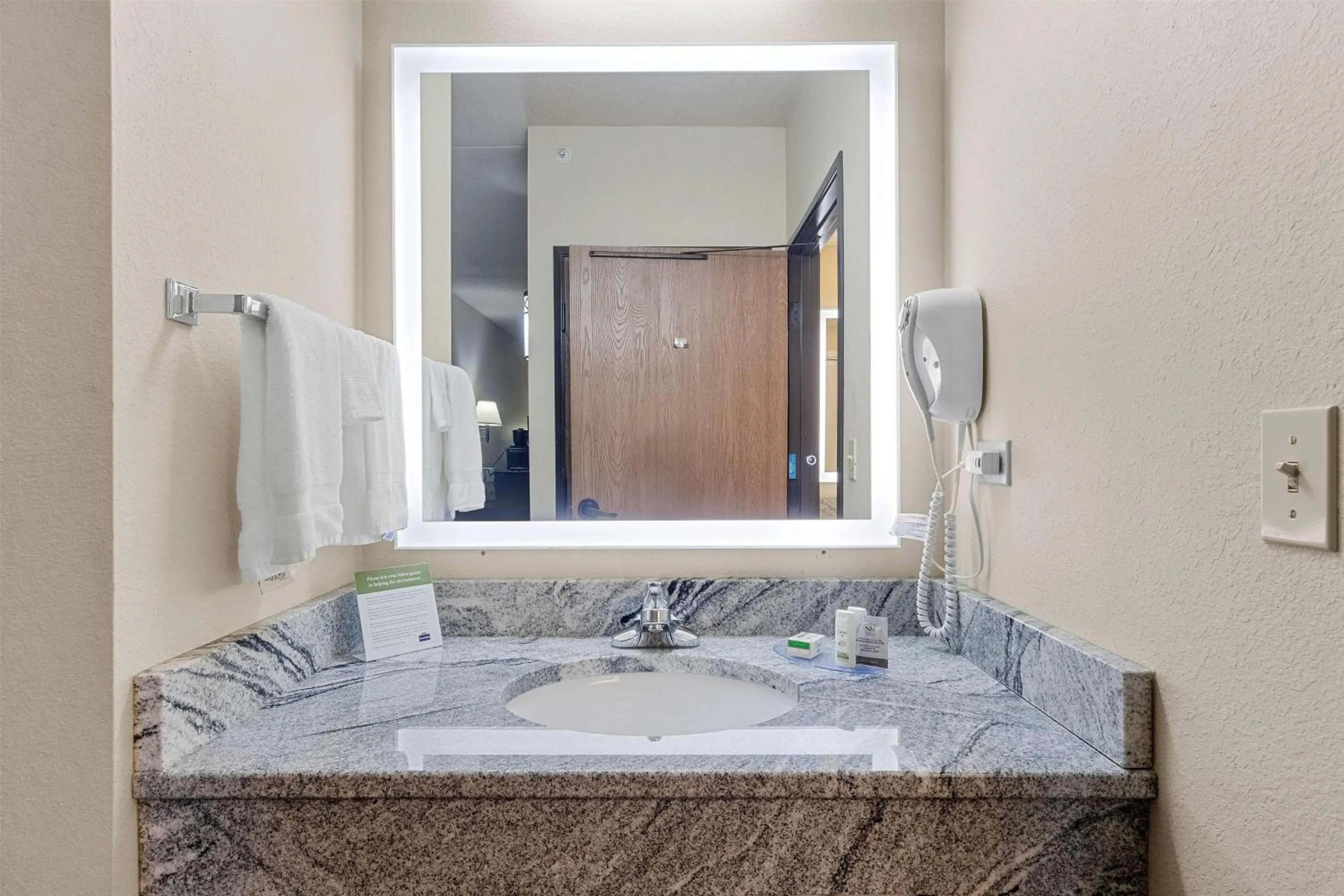 Bathroom in AmericInn by Wyndham Green Bay East