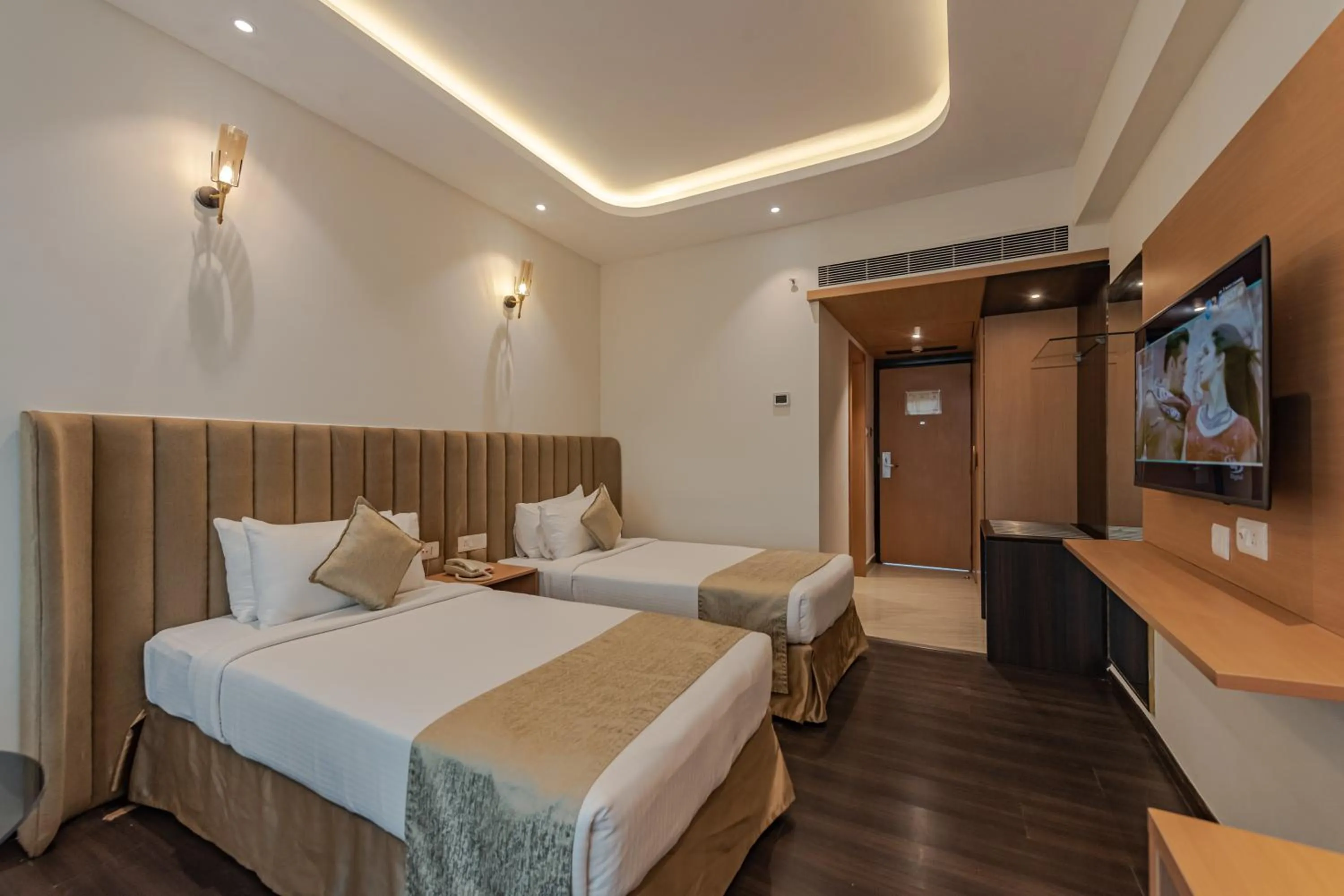 Bed in Goldfinch Hotel Mangalore