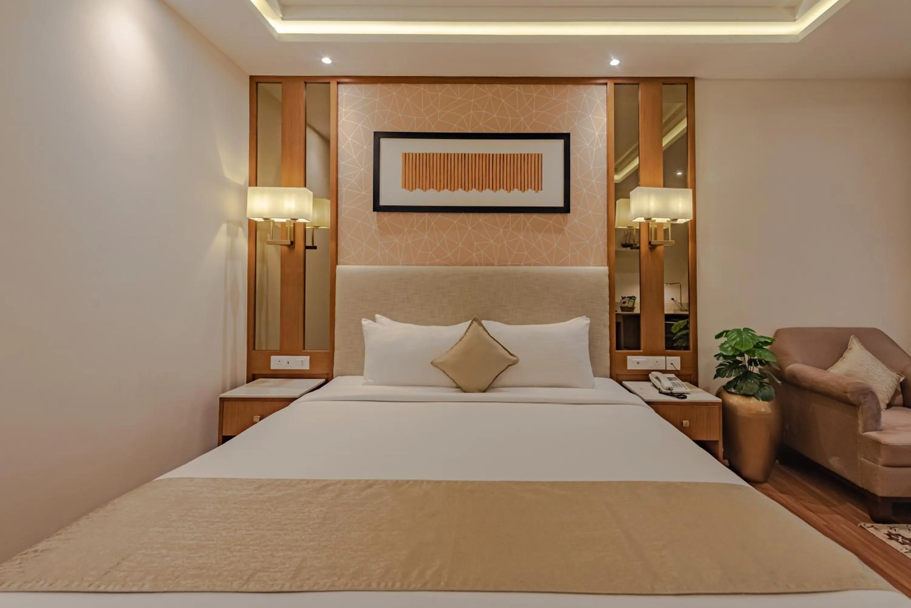 Bed in Goldfinch Hotel Mangalore