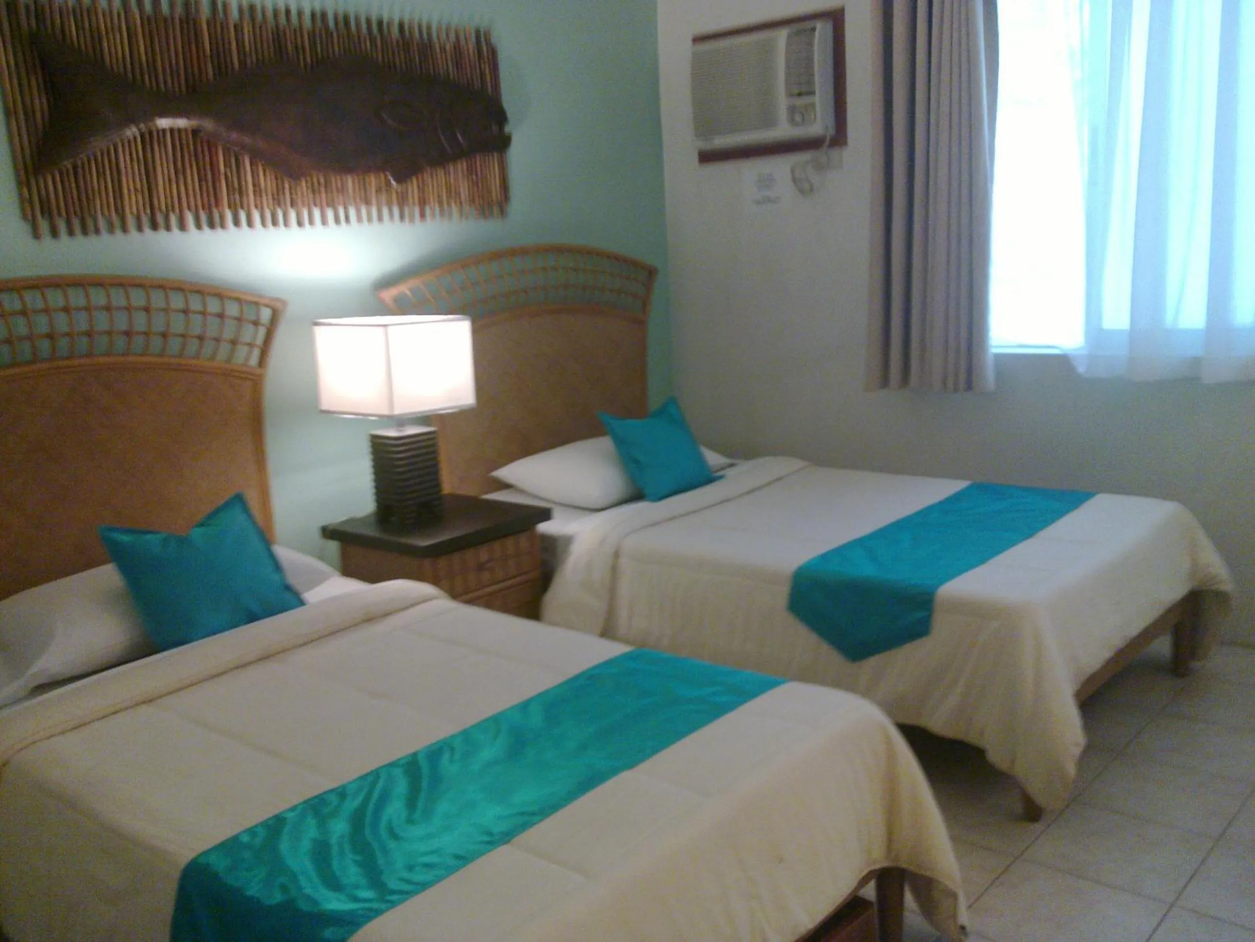 Bed in Eagle Point Beach and Dive Resort