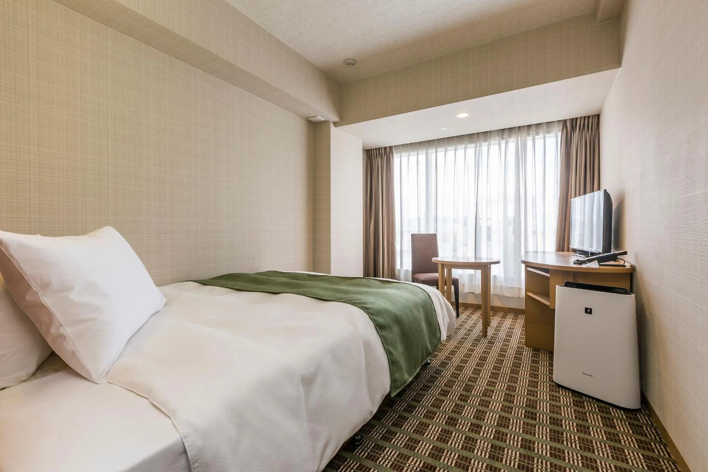 Bed in Garden Hotel Shizuoka