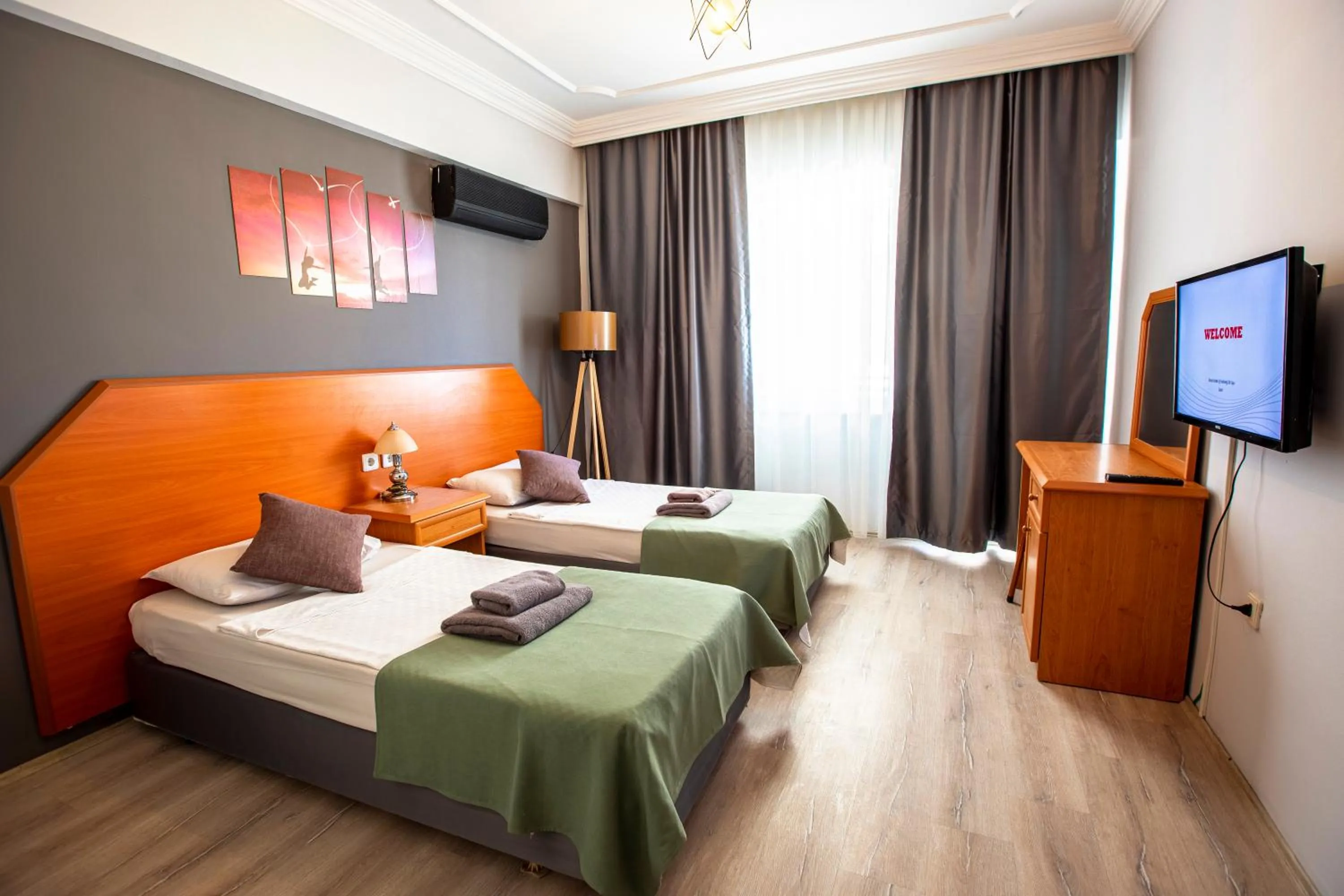 Bed in HMA Hotel & Suites