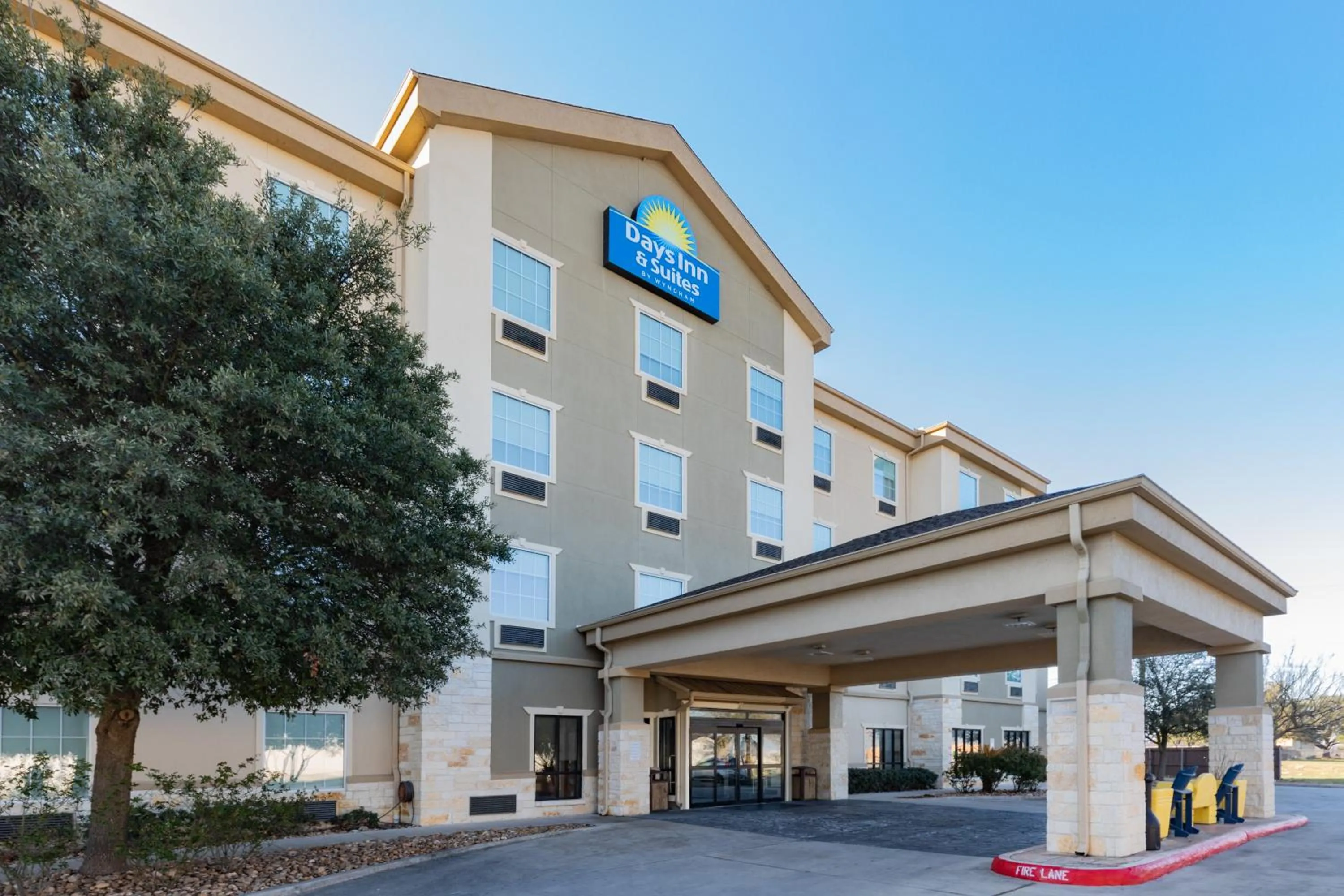 Property building in Days Inn & Suites by Wyndham San Antonio near Frost Bank Center
