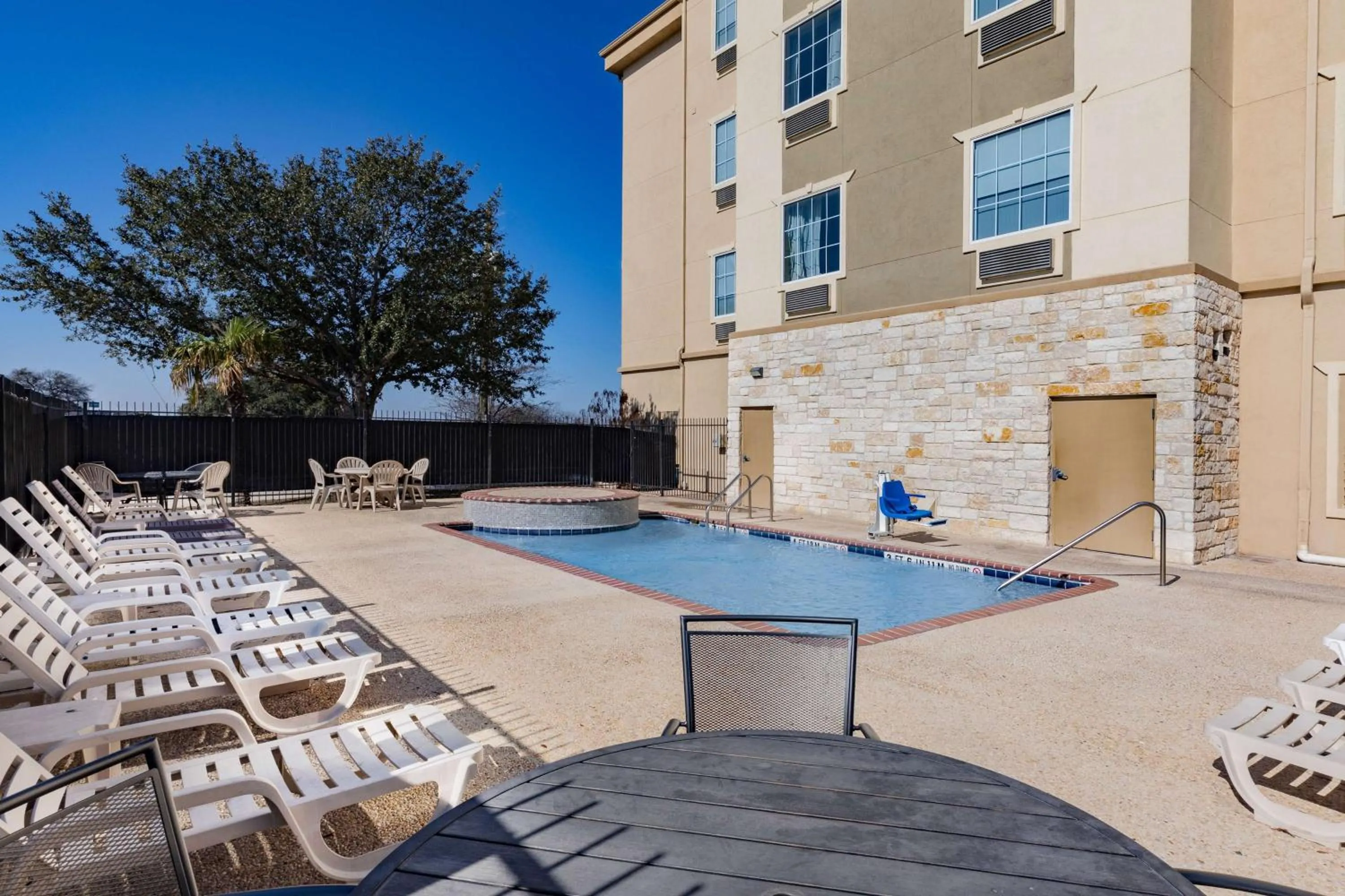 Pool view in Days Inn & Suites by Wyndham San Antonio near Frost Bank Center