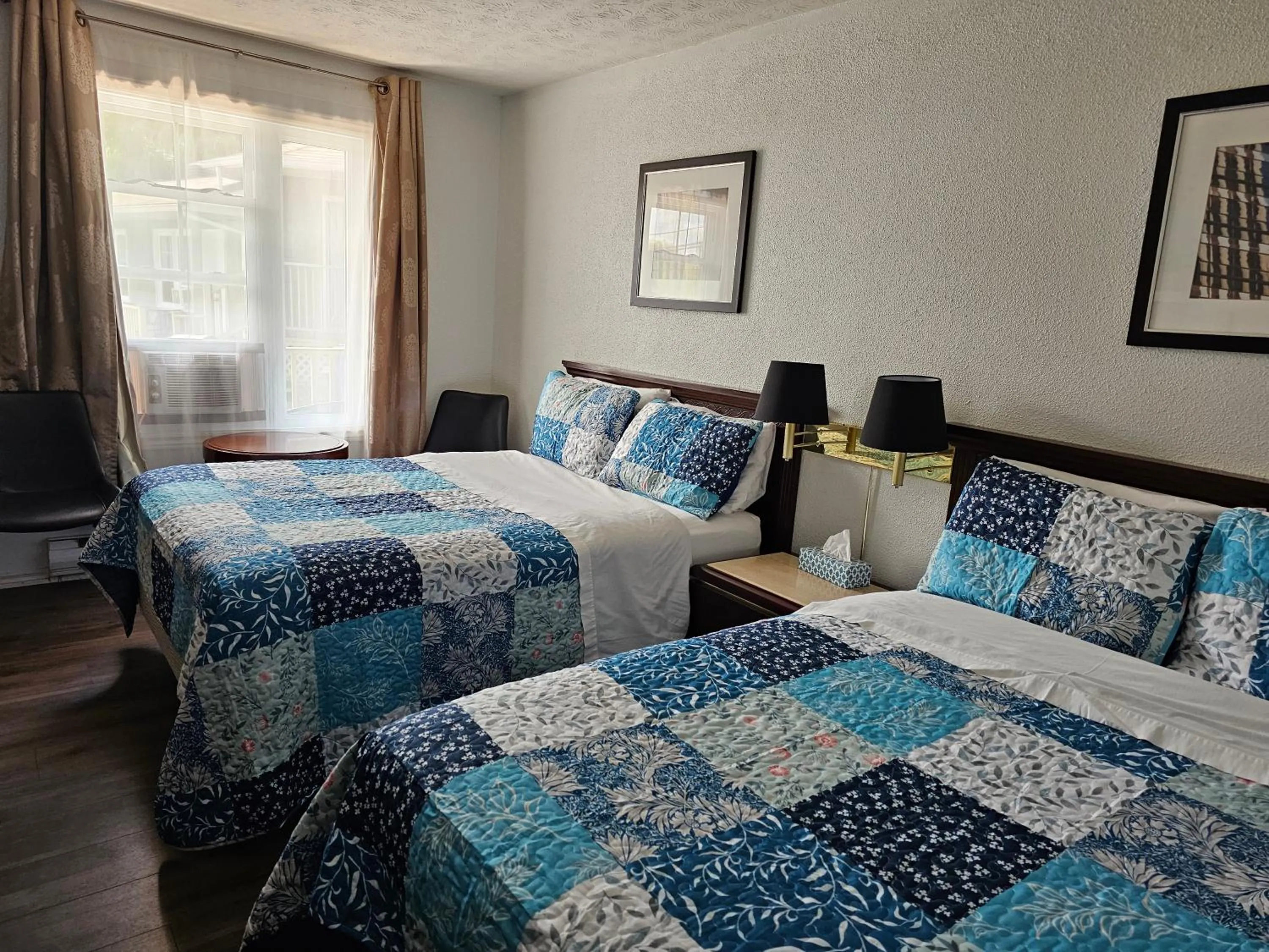 Bed in Motel de l'Outlet