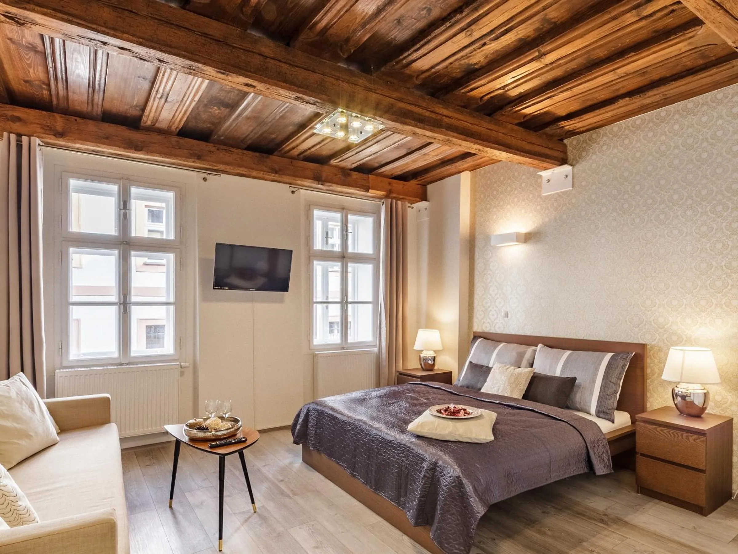 Bed in Downtown Royal Apartments