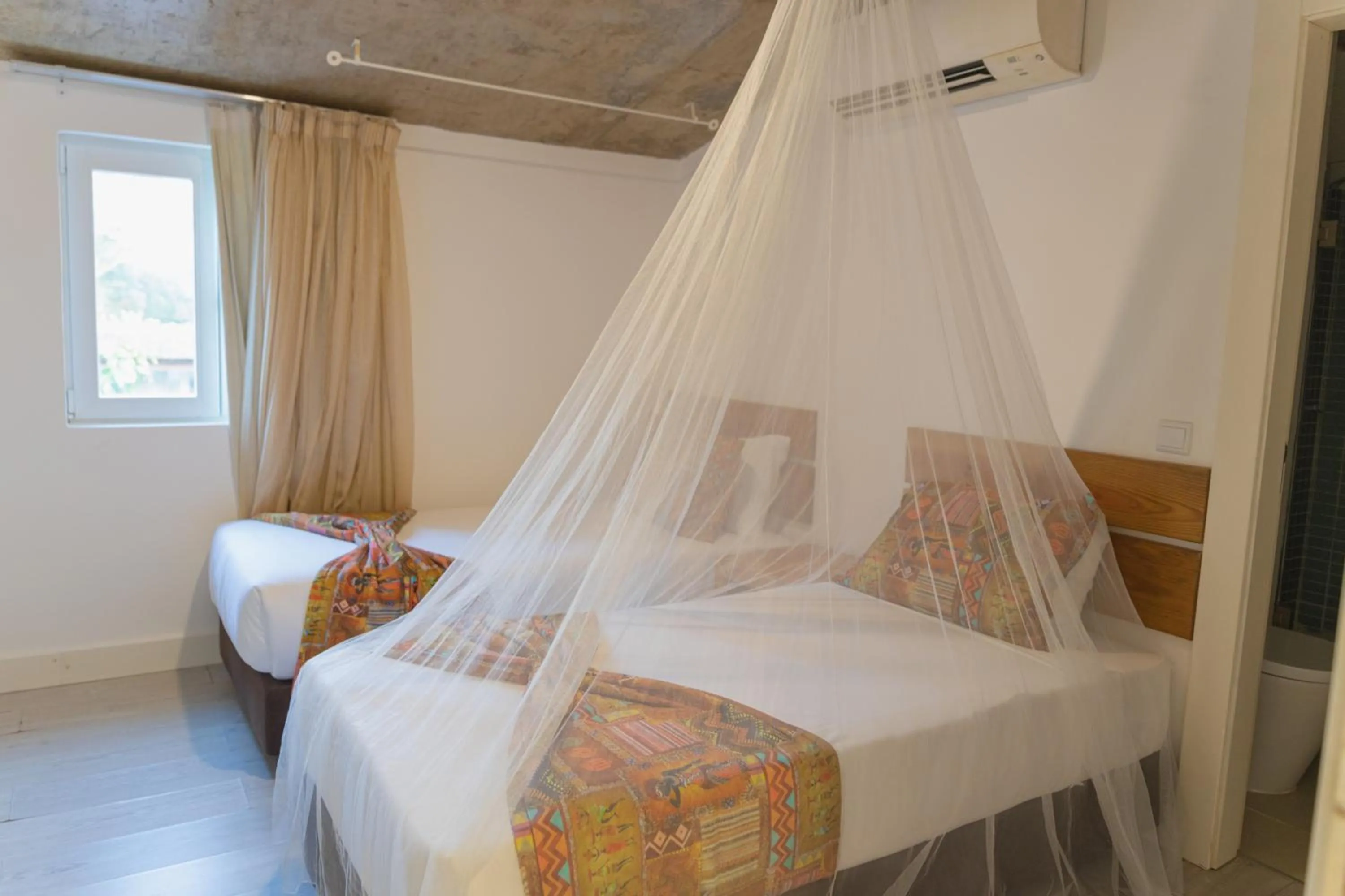 Bed in Roça Santo António Ecolodge