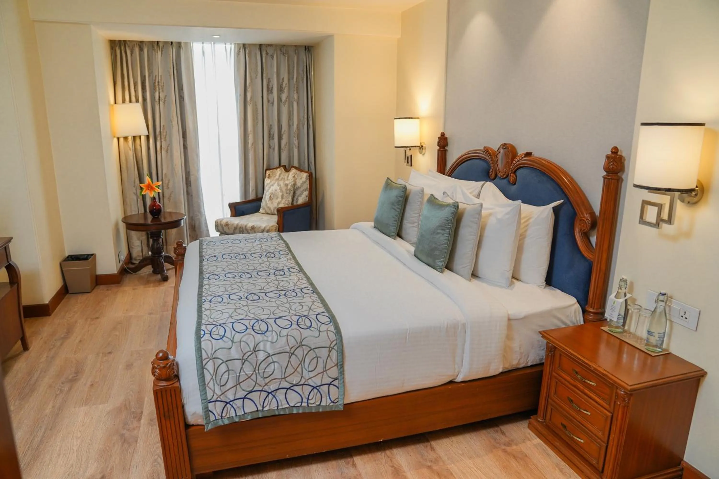 Photo of the whole room, Bed in Golden Sarovar Portico