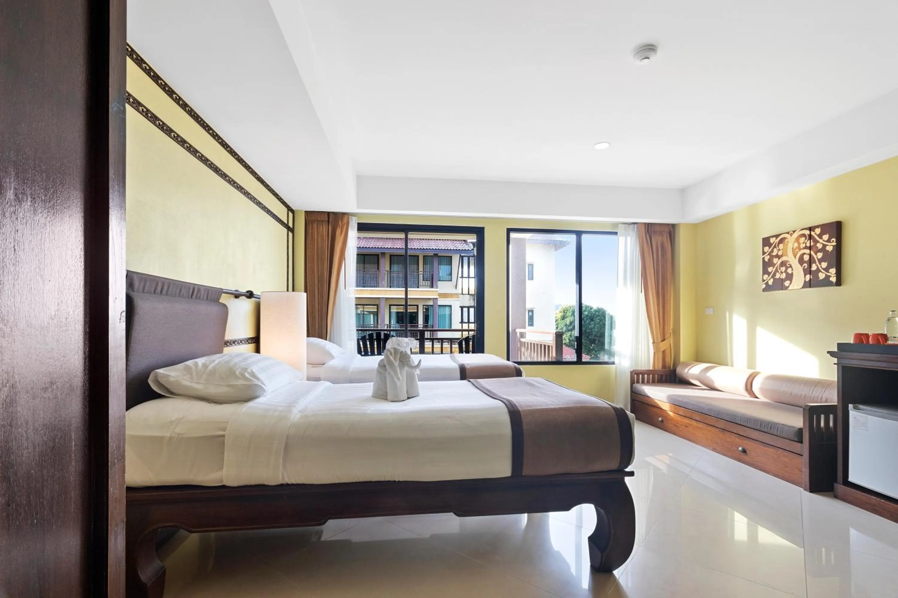 Bed in Diamond Cottage Resort & Spa