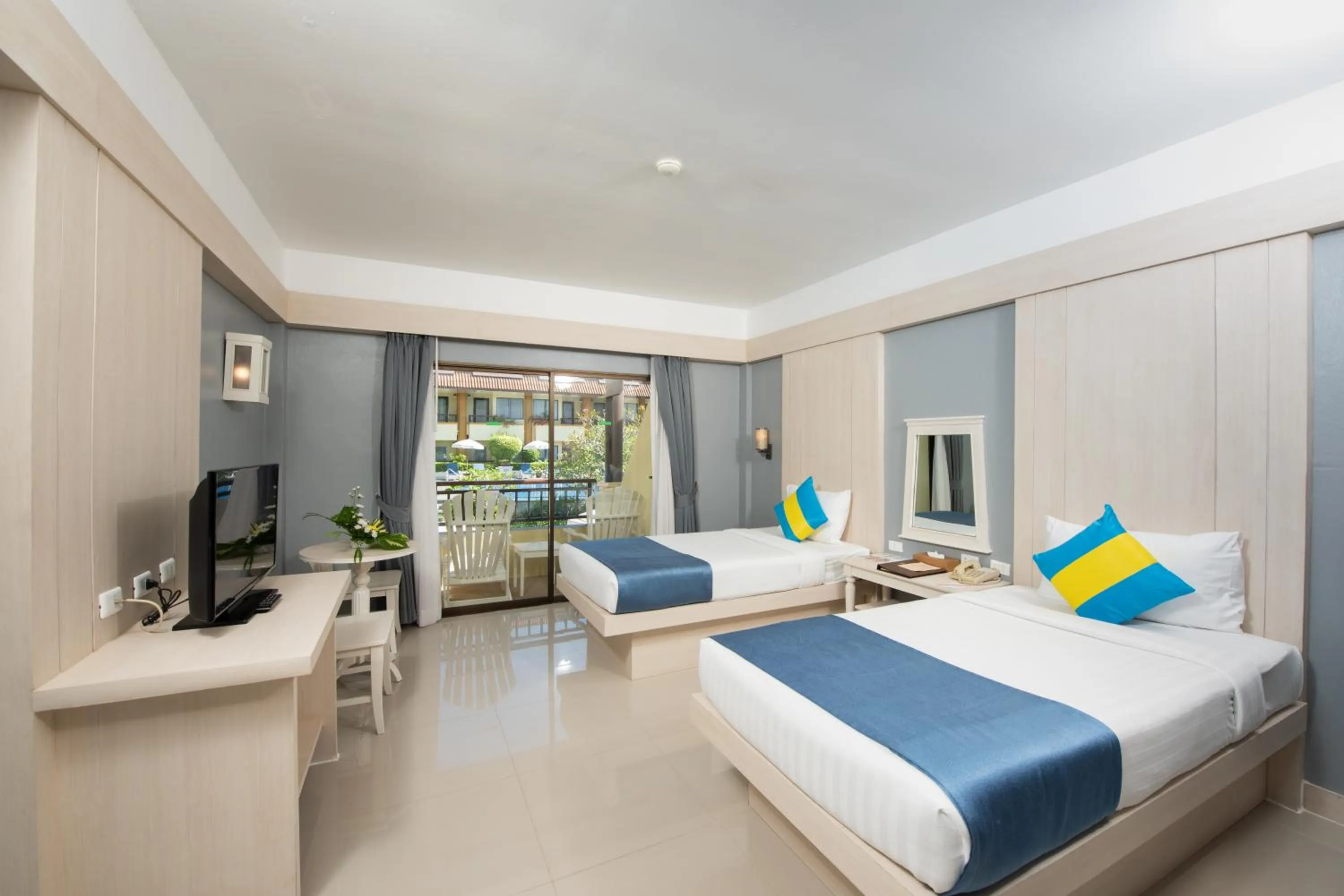 Bed in Diamond Cottage Resort & Spa