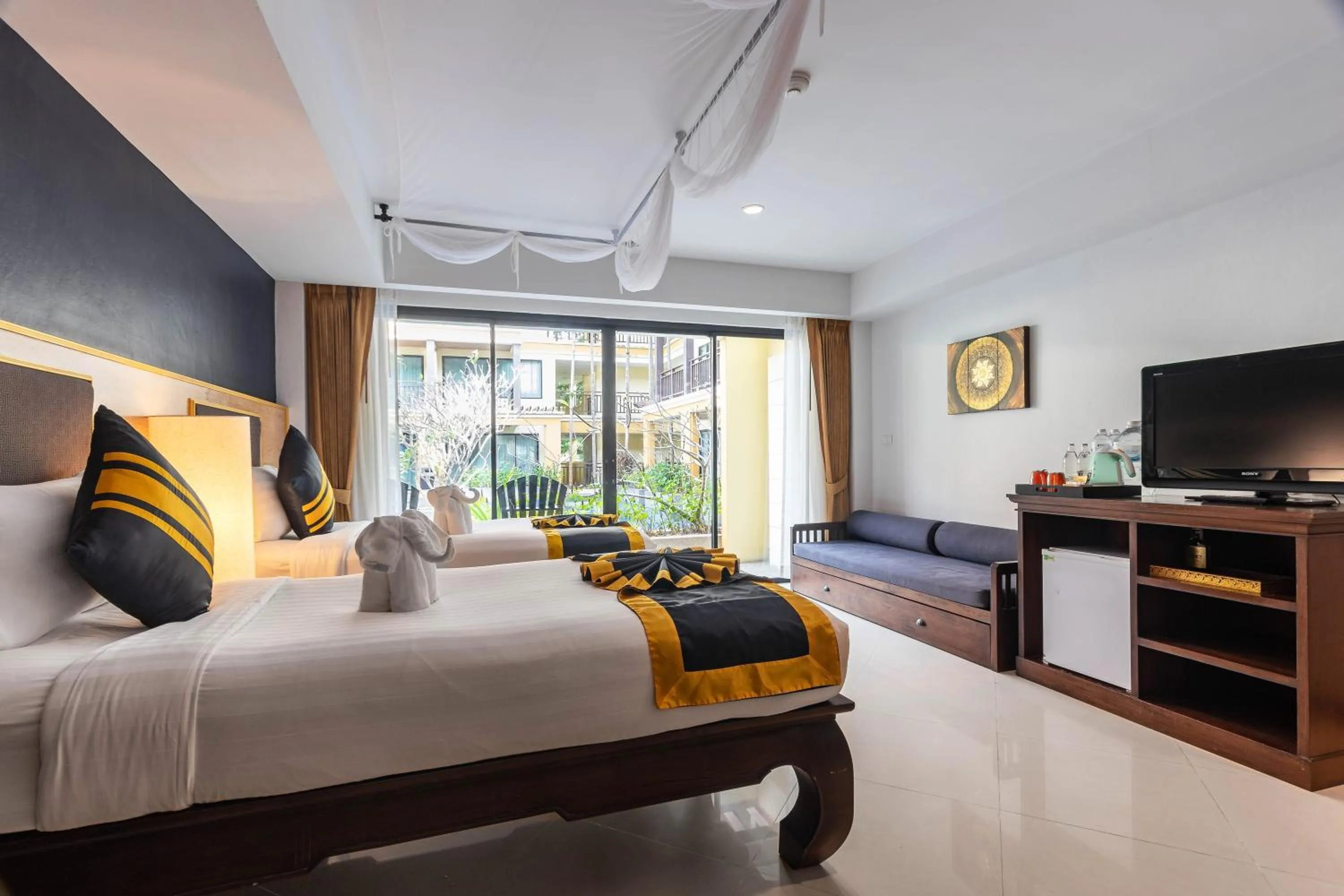 Bed in Diamond Cottage Resort & Spa