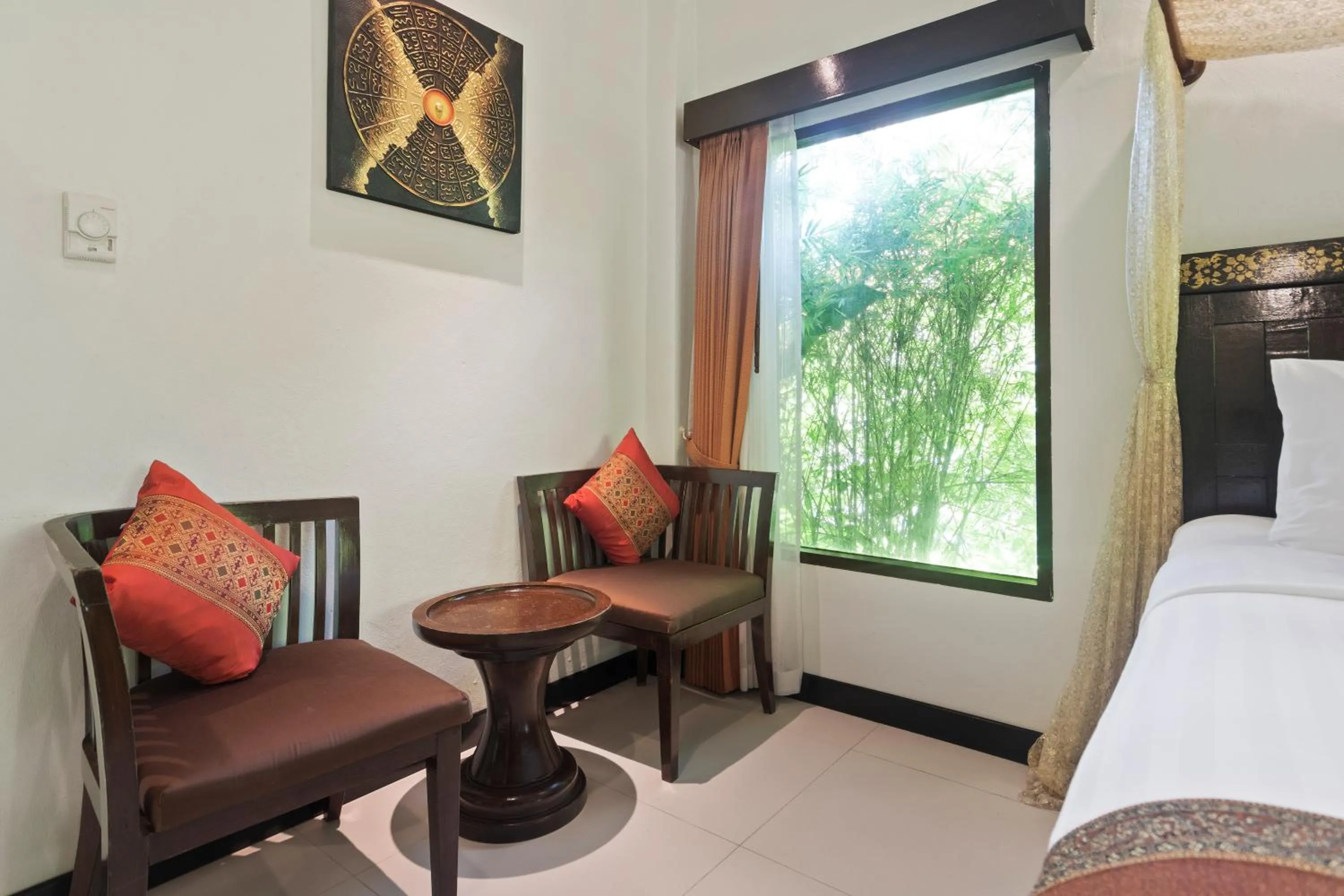 Seating area, Bed in Diamond Cottage Resort & Spa