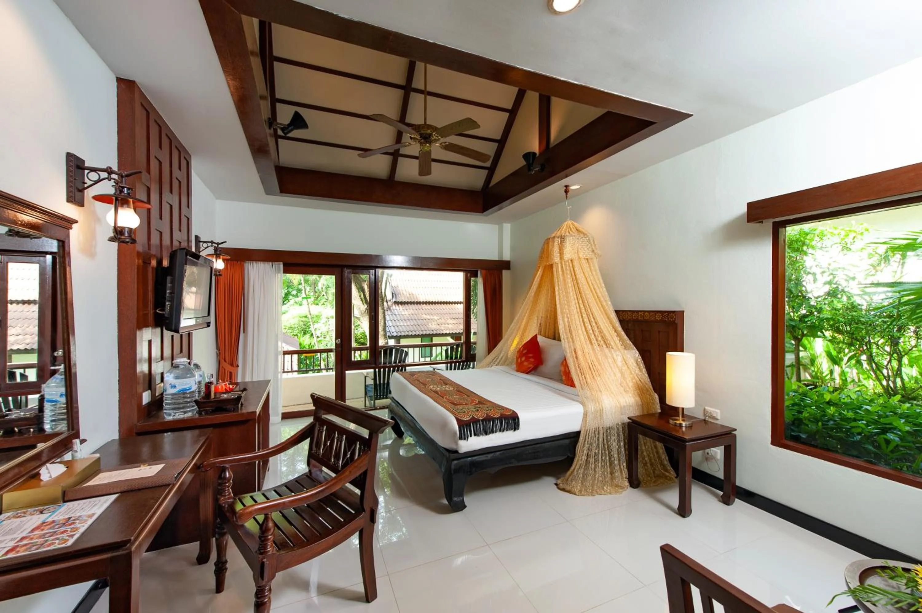 Bed in Diamond Cottage Resort & Spa