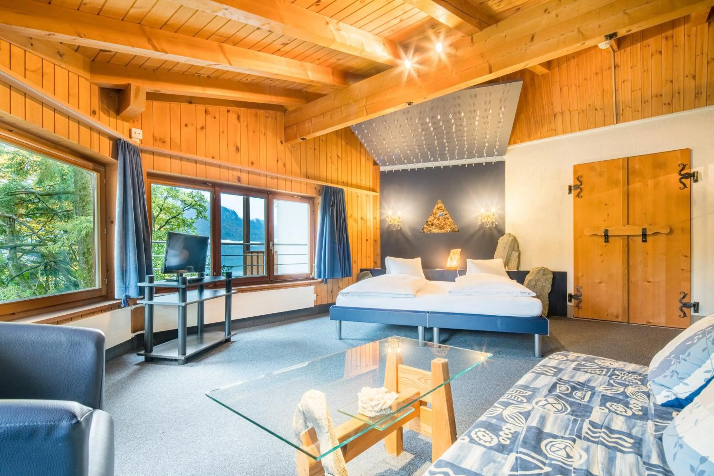 Seating area, Bed in Hotel Lindenhof by Crossworld AG