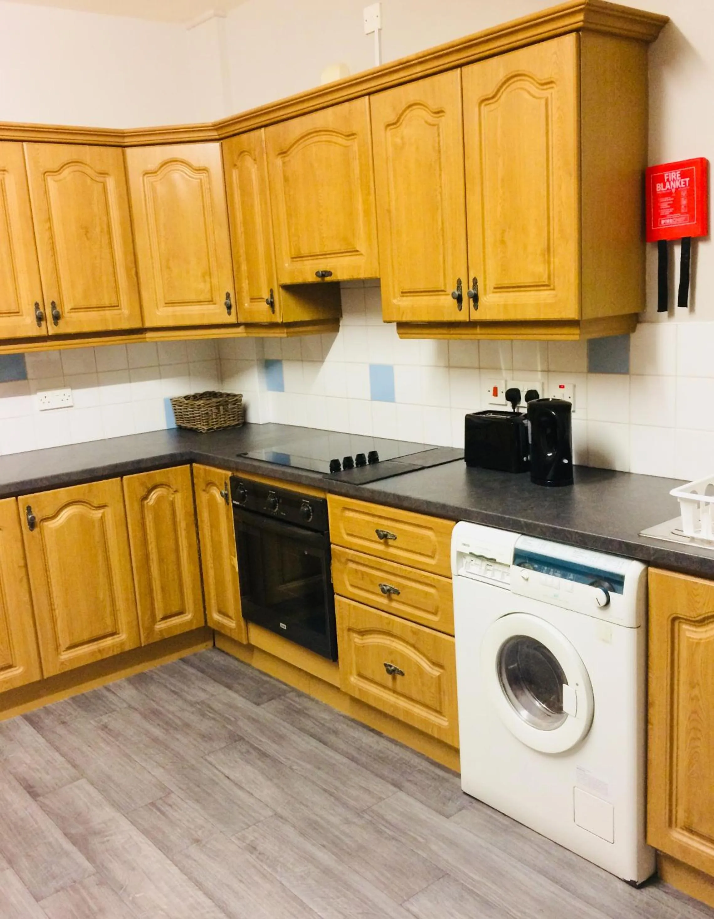 Communal kitchen in Lwr Ormeau Guest House