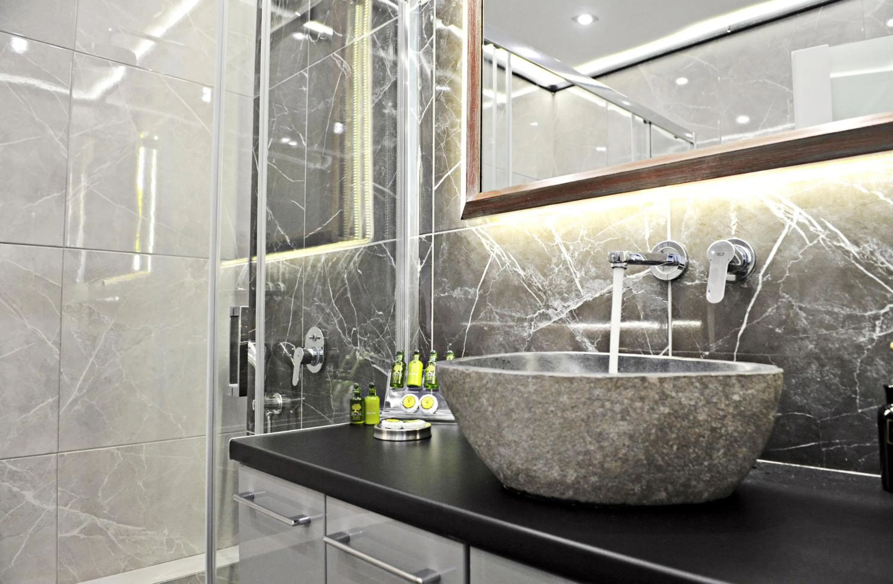 Shower in The Athenians Modern Apartments