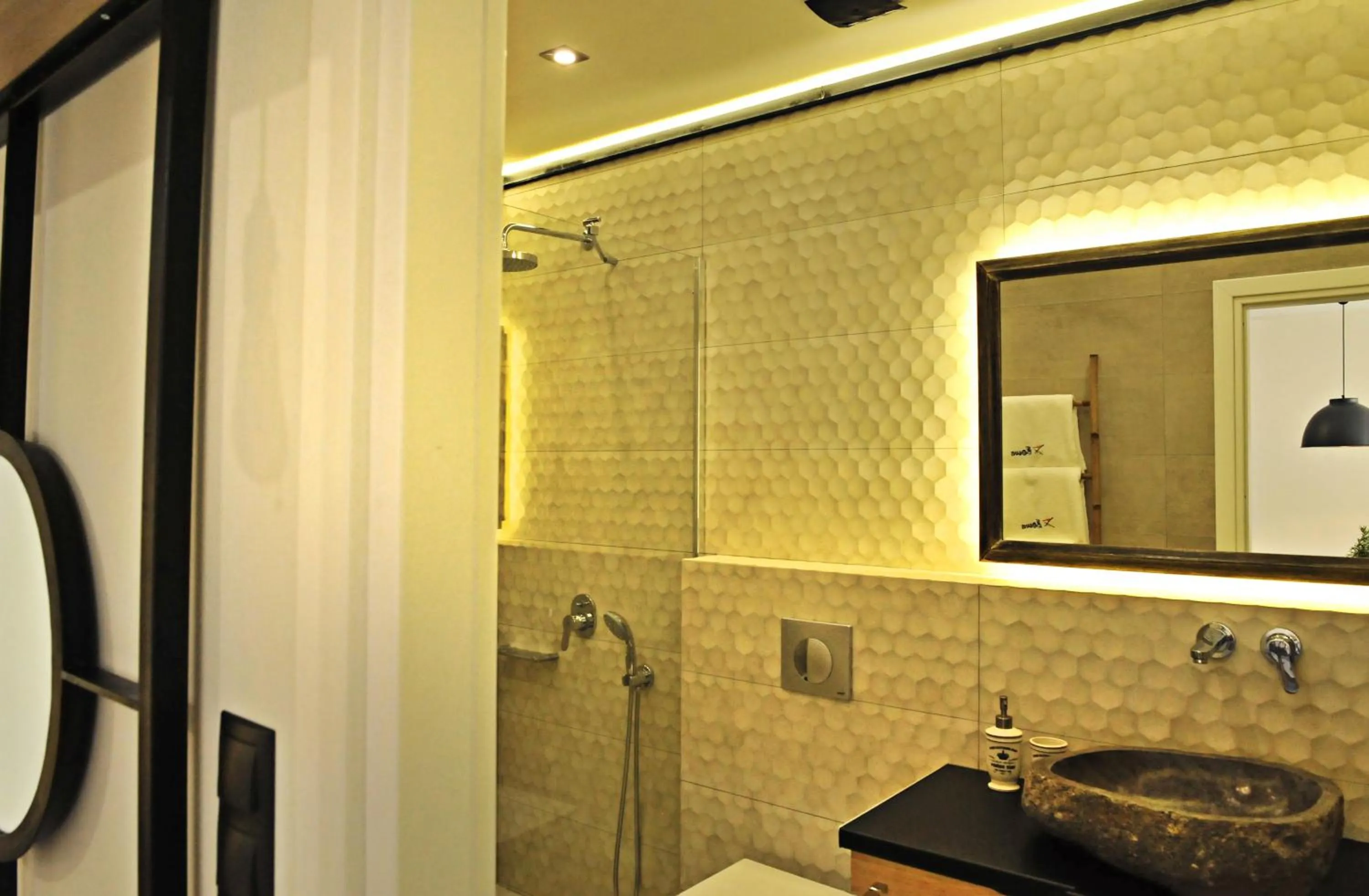 Shower in The Athenians Modern Apartments