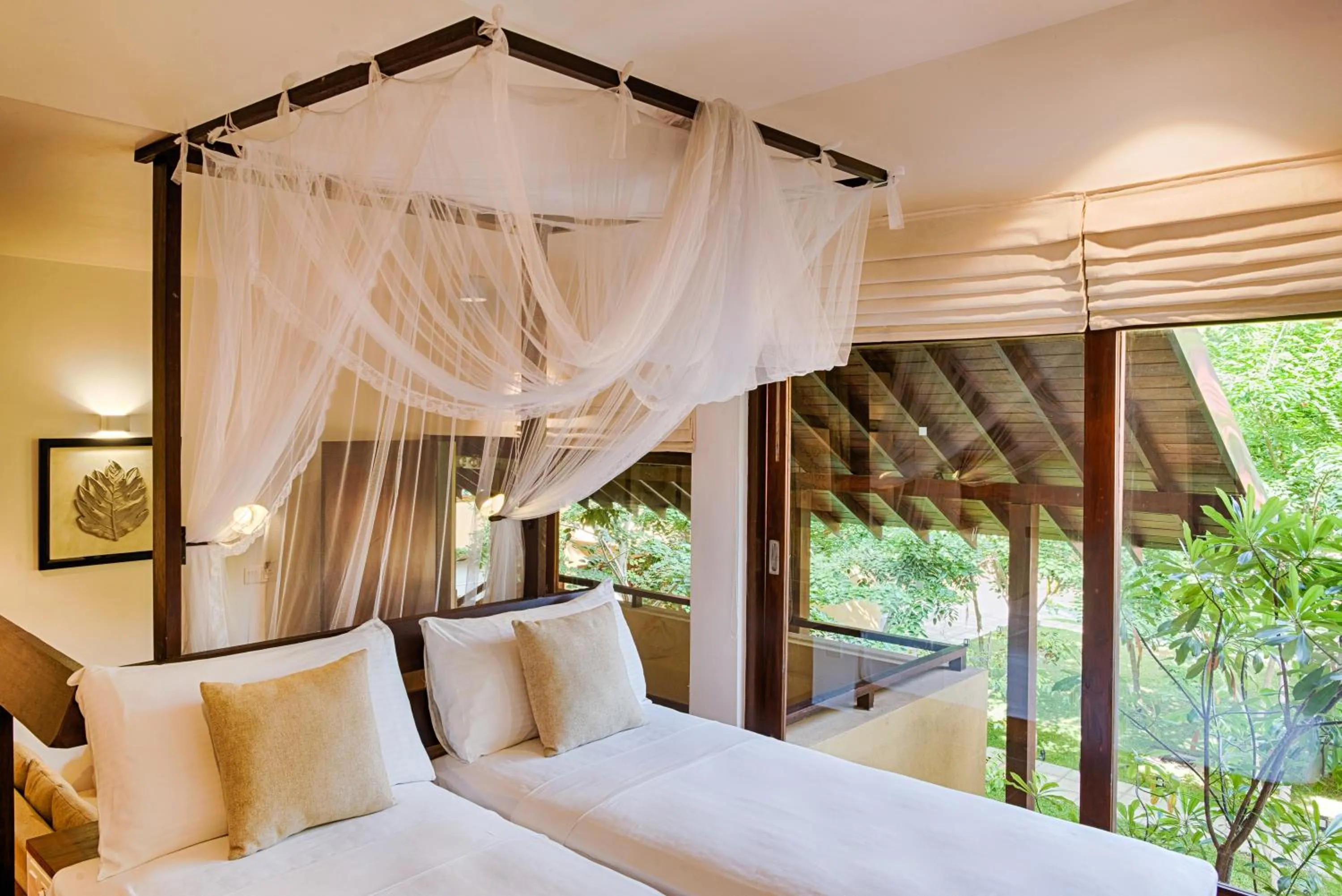 Bed in Jetwing Ayurveda Pavilions