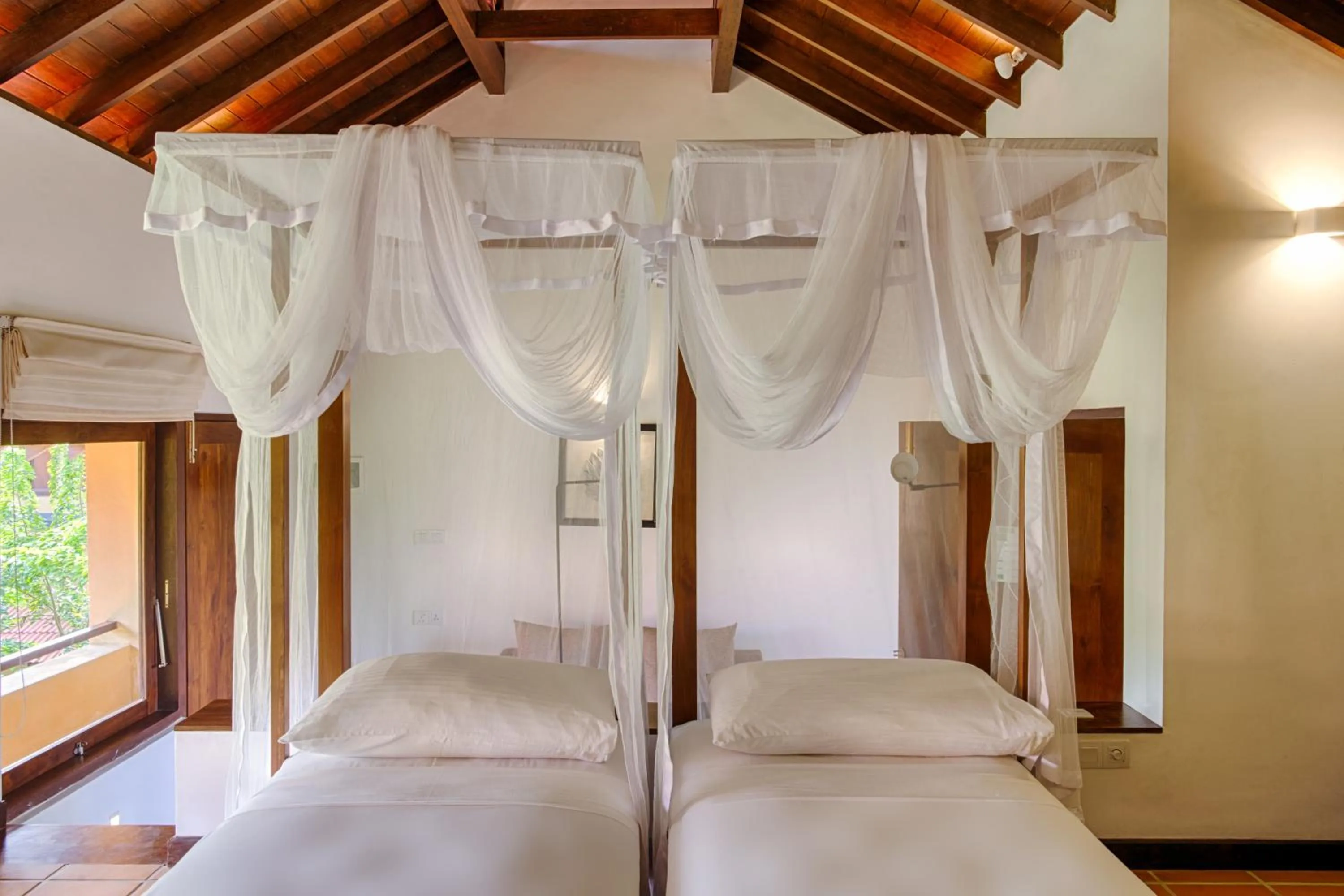 Bed in Jetwing Ayurveda Pavilions