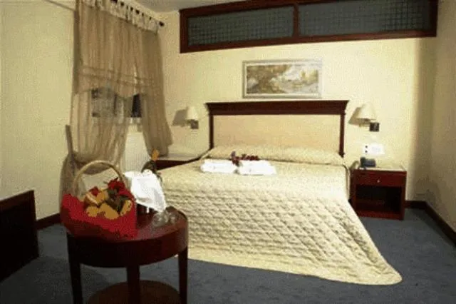 Bed in Crithoni's Paradise Hotel