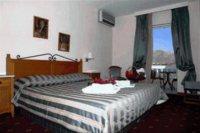 Bed in Crithoni's Paradise Hotel