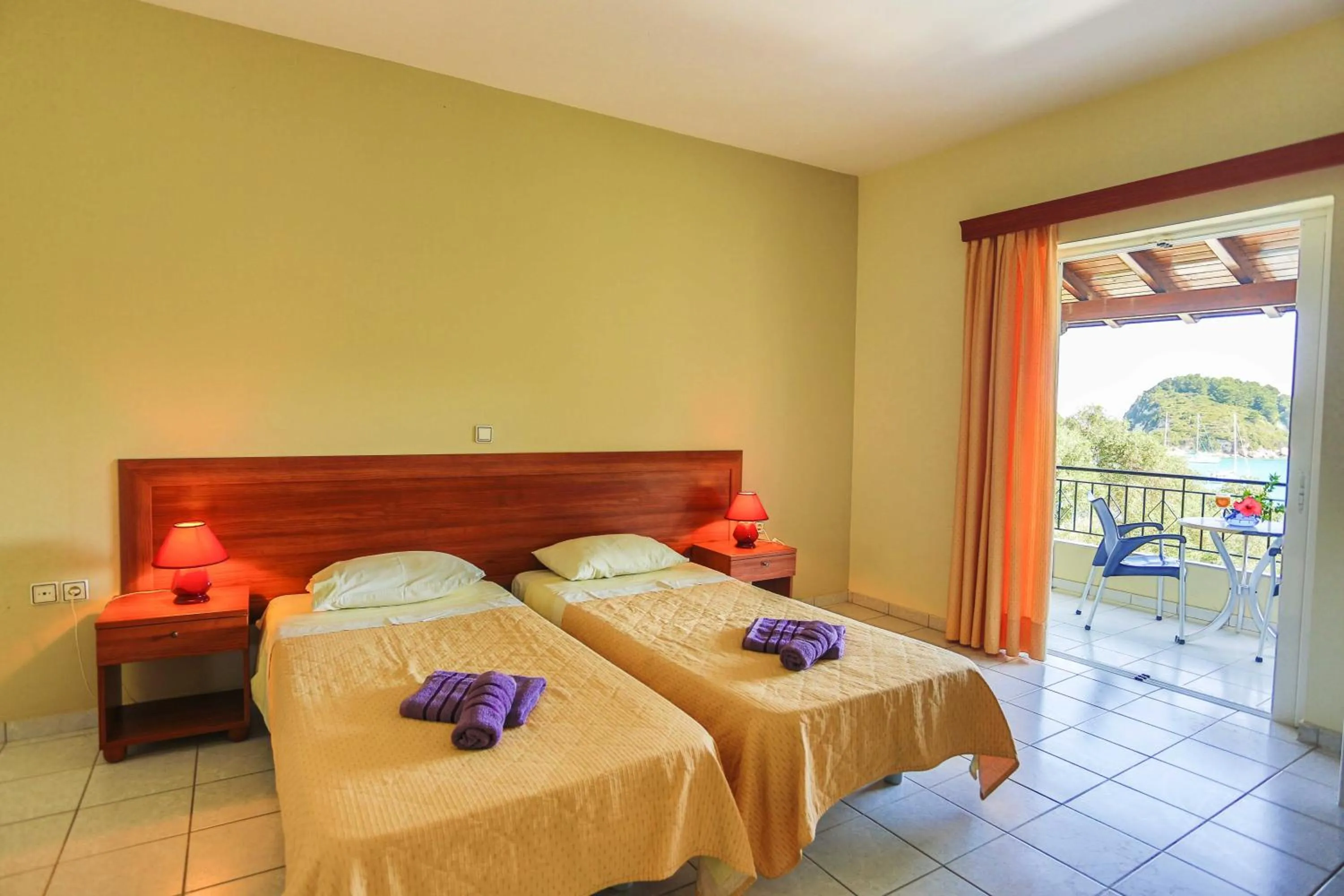 Bed in Amfitriti Hotel & Studios