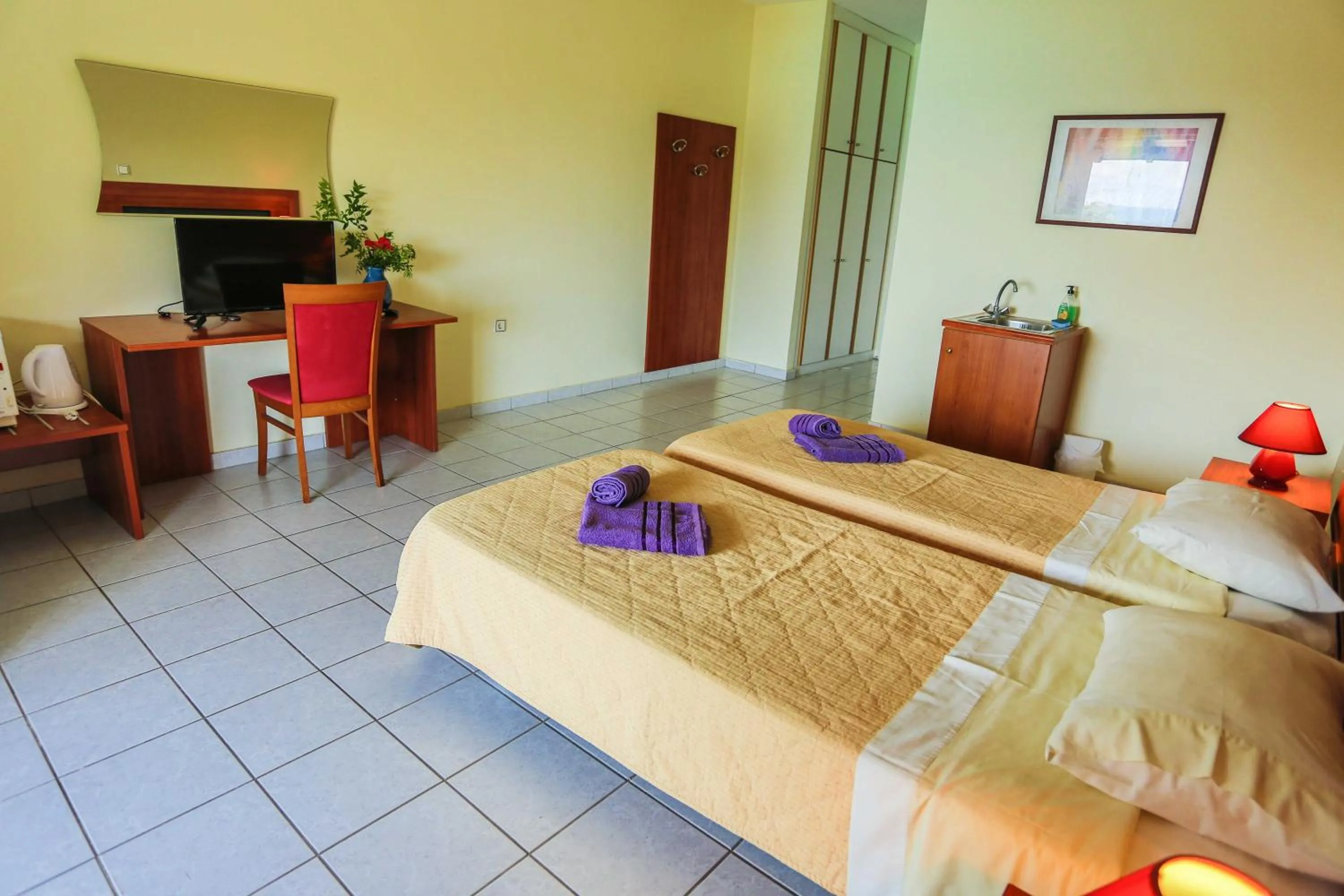 Bed in Amfitriti Hotel & Studios