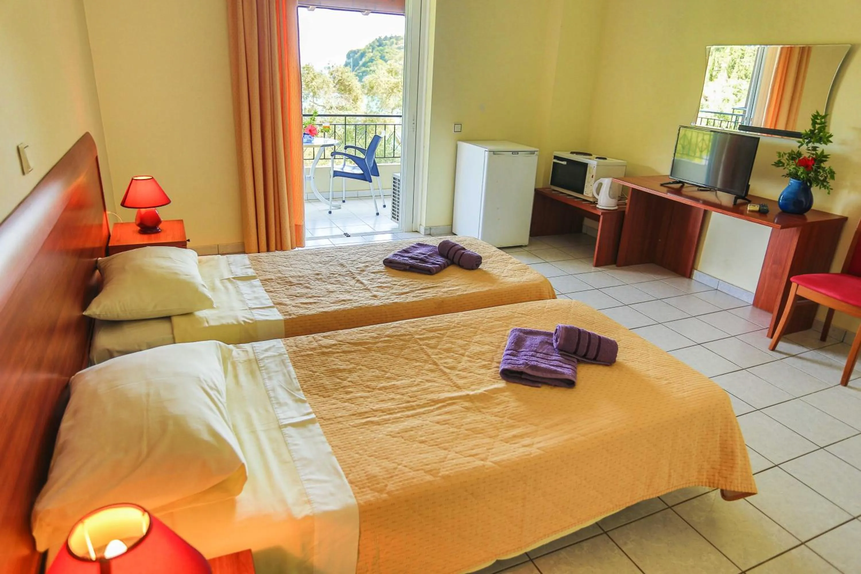 Bed in Amfitriti Hotel & Studios