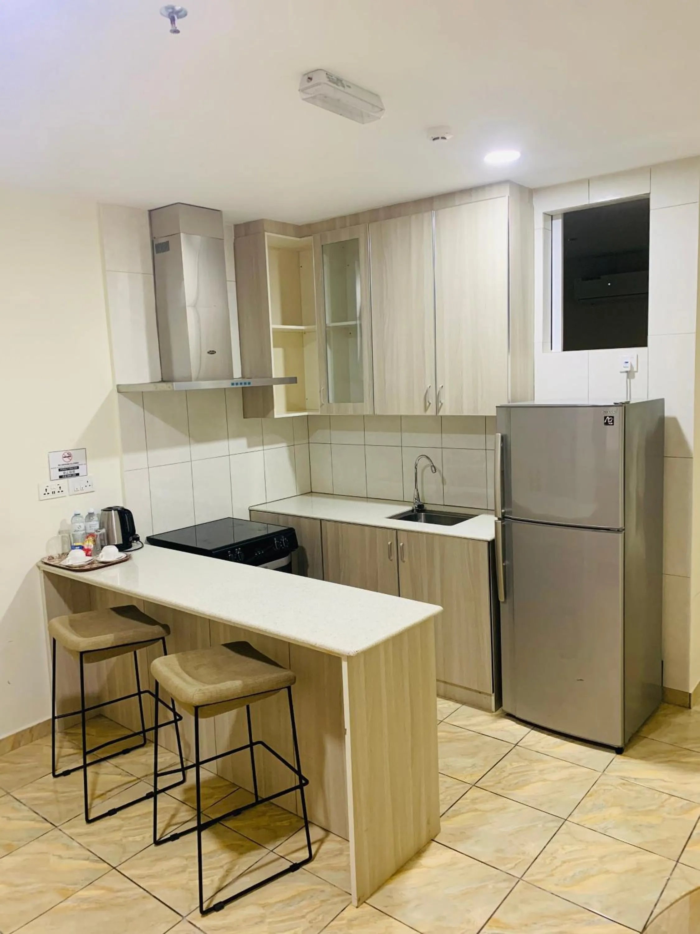 Kitchen or kitchenette in Wafa Hotel & Apartment