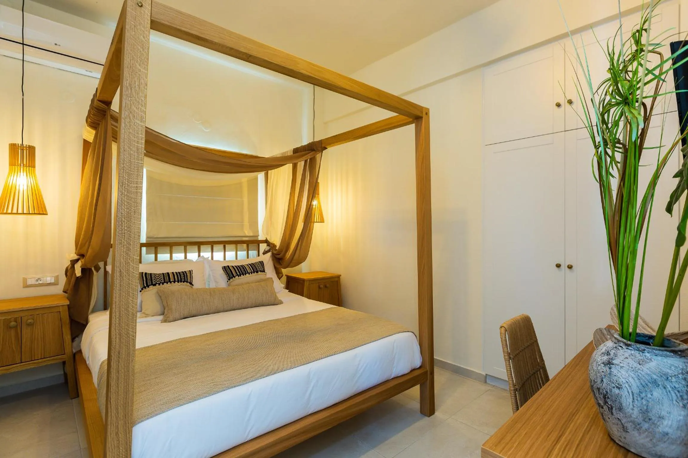 Bed in Nostos Beach Boutique Hotel