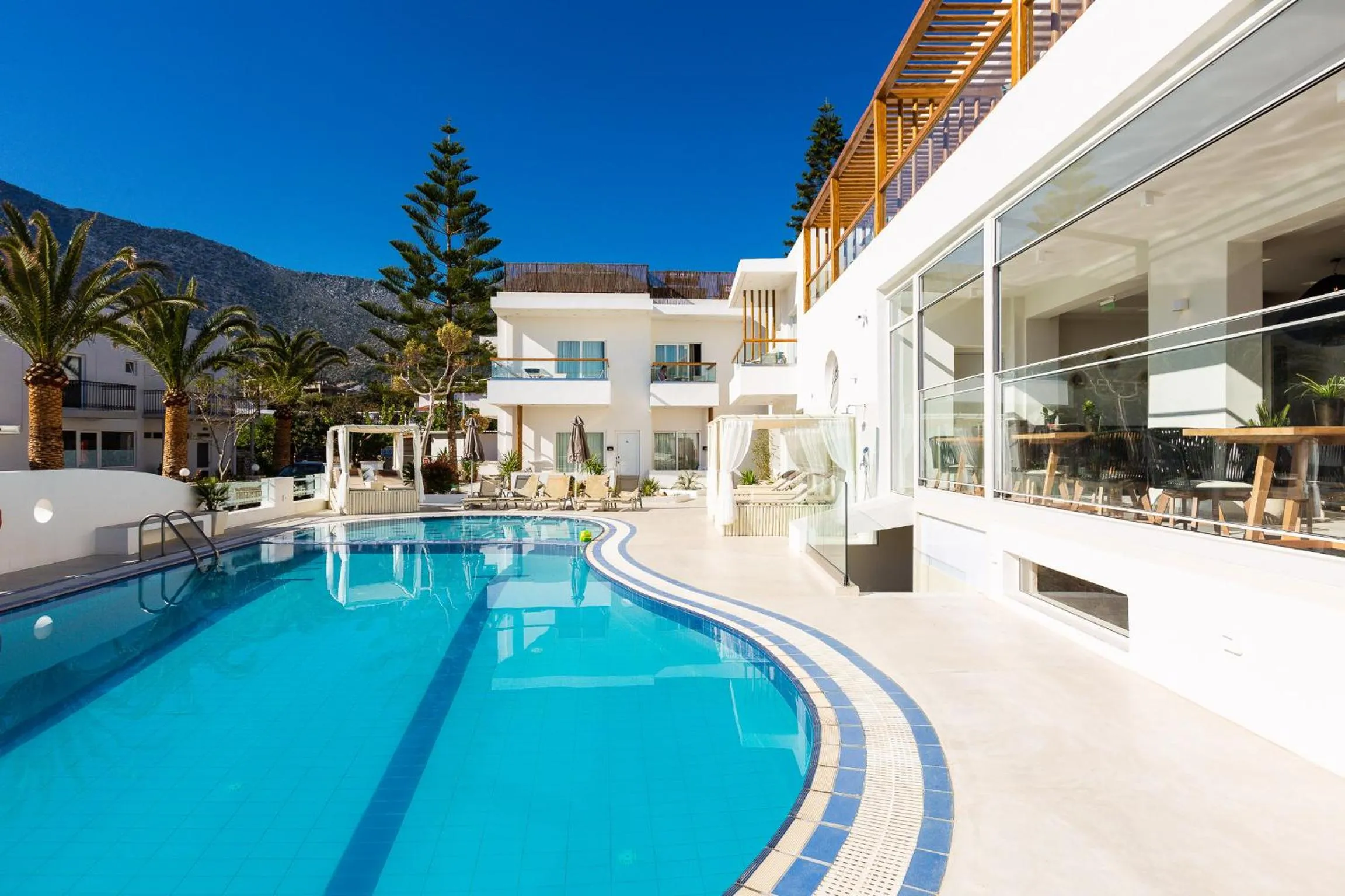 Swimming pool in Nostos Beach Boutique Hotel