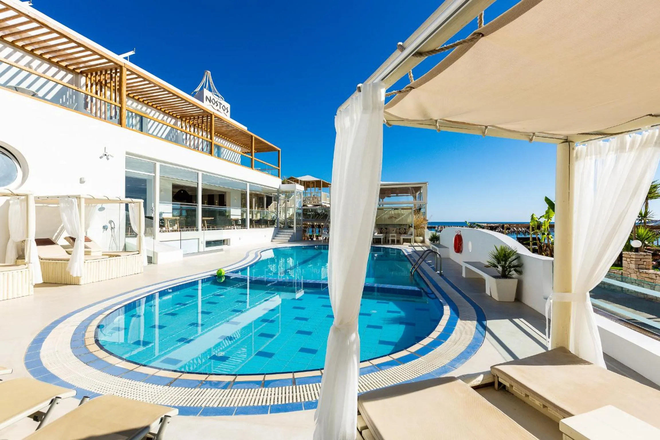 Swimming pool in Nostos Beach Boutique Hotel