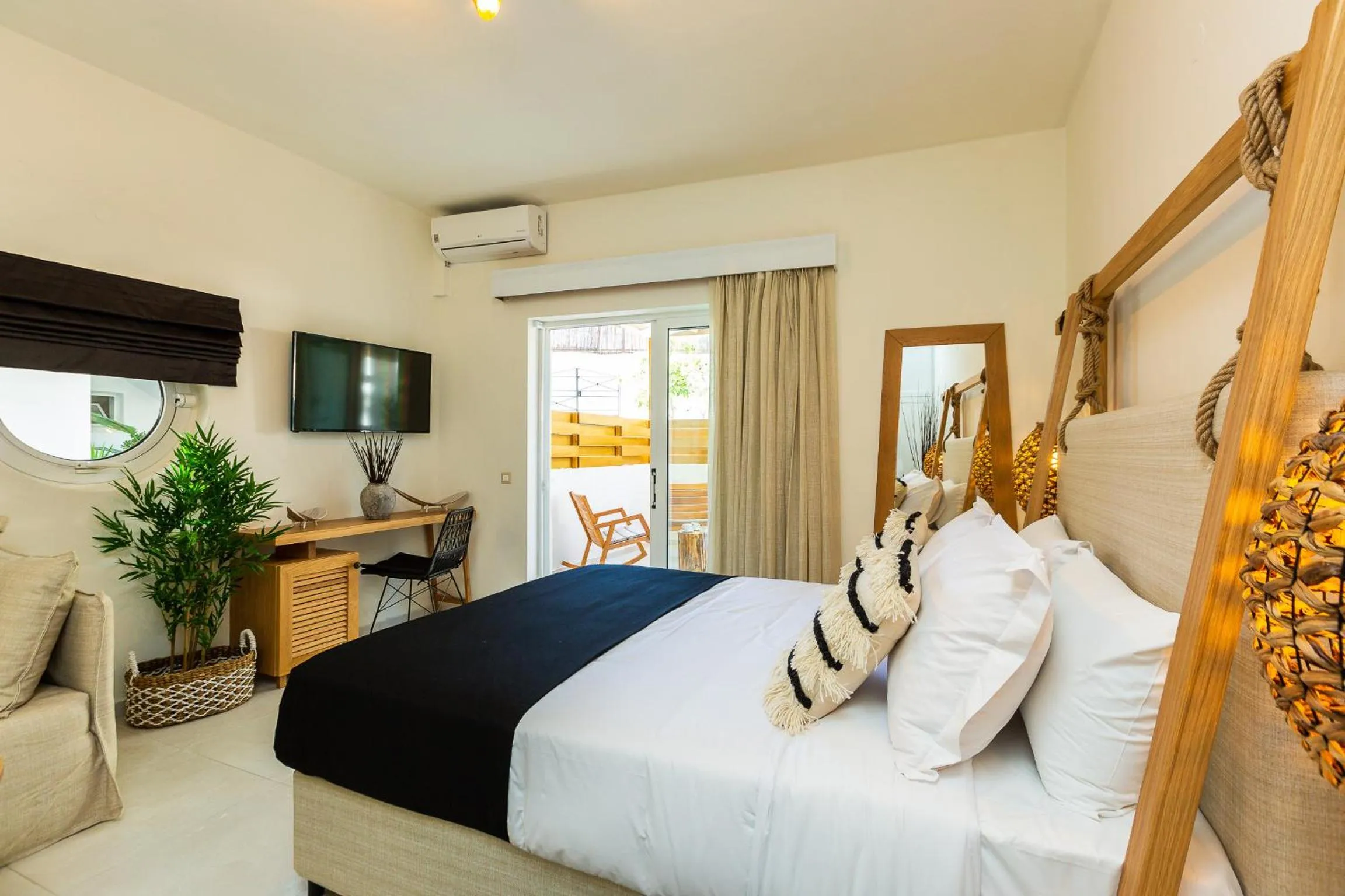 Bed in Nostos Beach Boutique Hotel