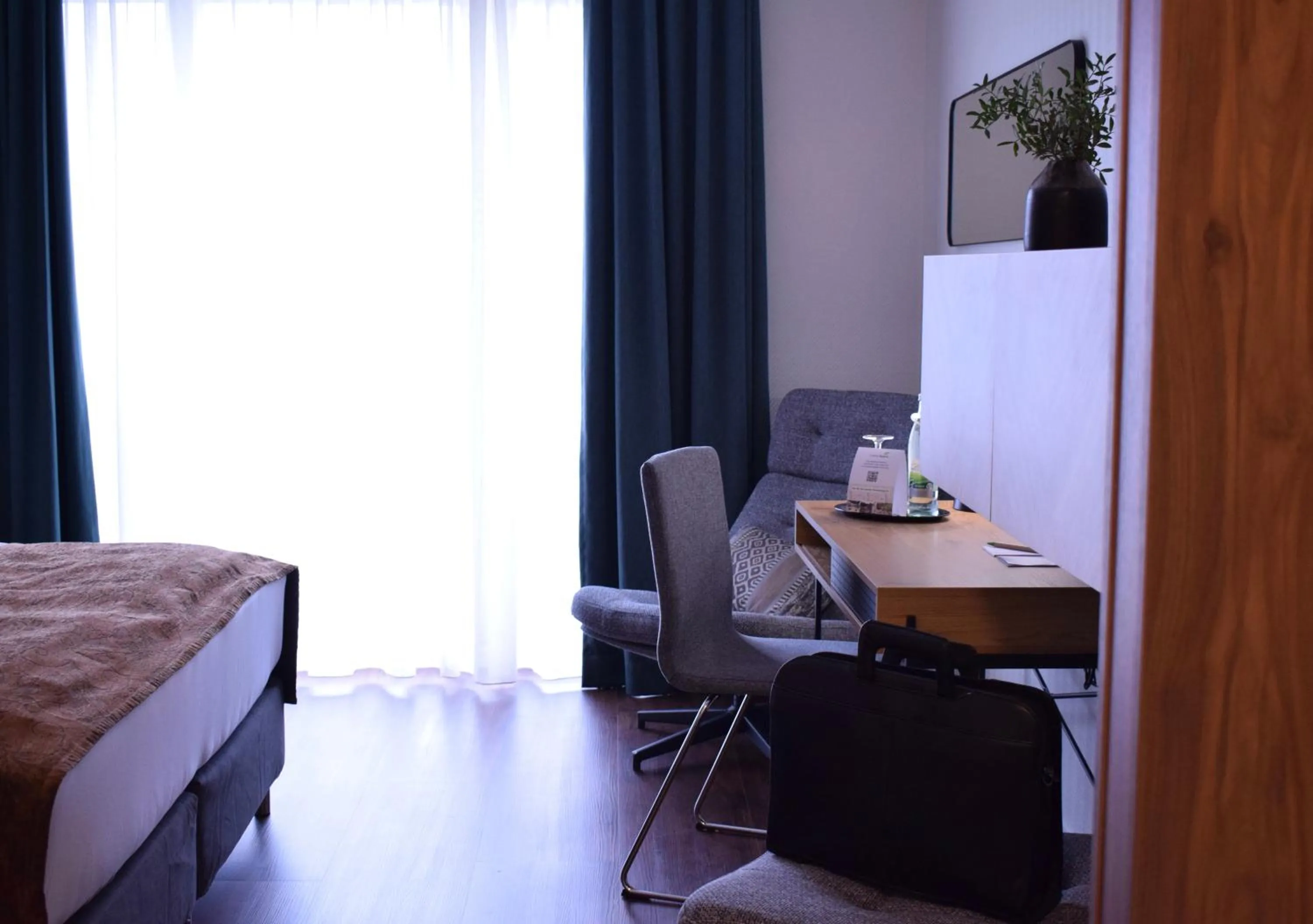 Photo of the whole room, Bed in Landhotel Rügheim