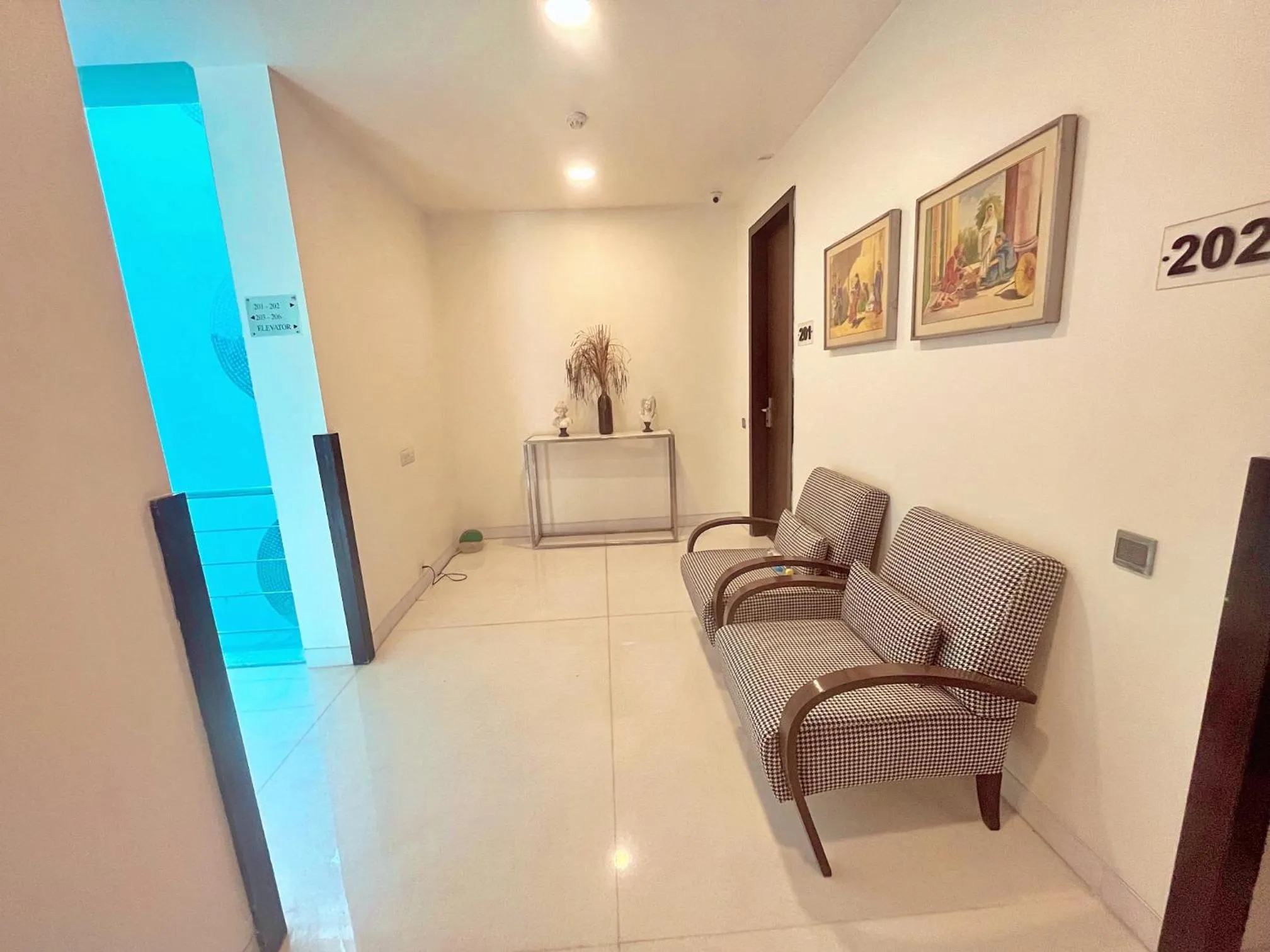 Seating area in Amber Inn by Orion Hotels