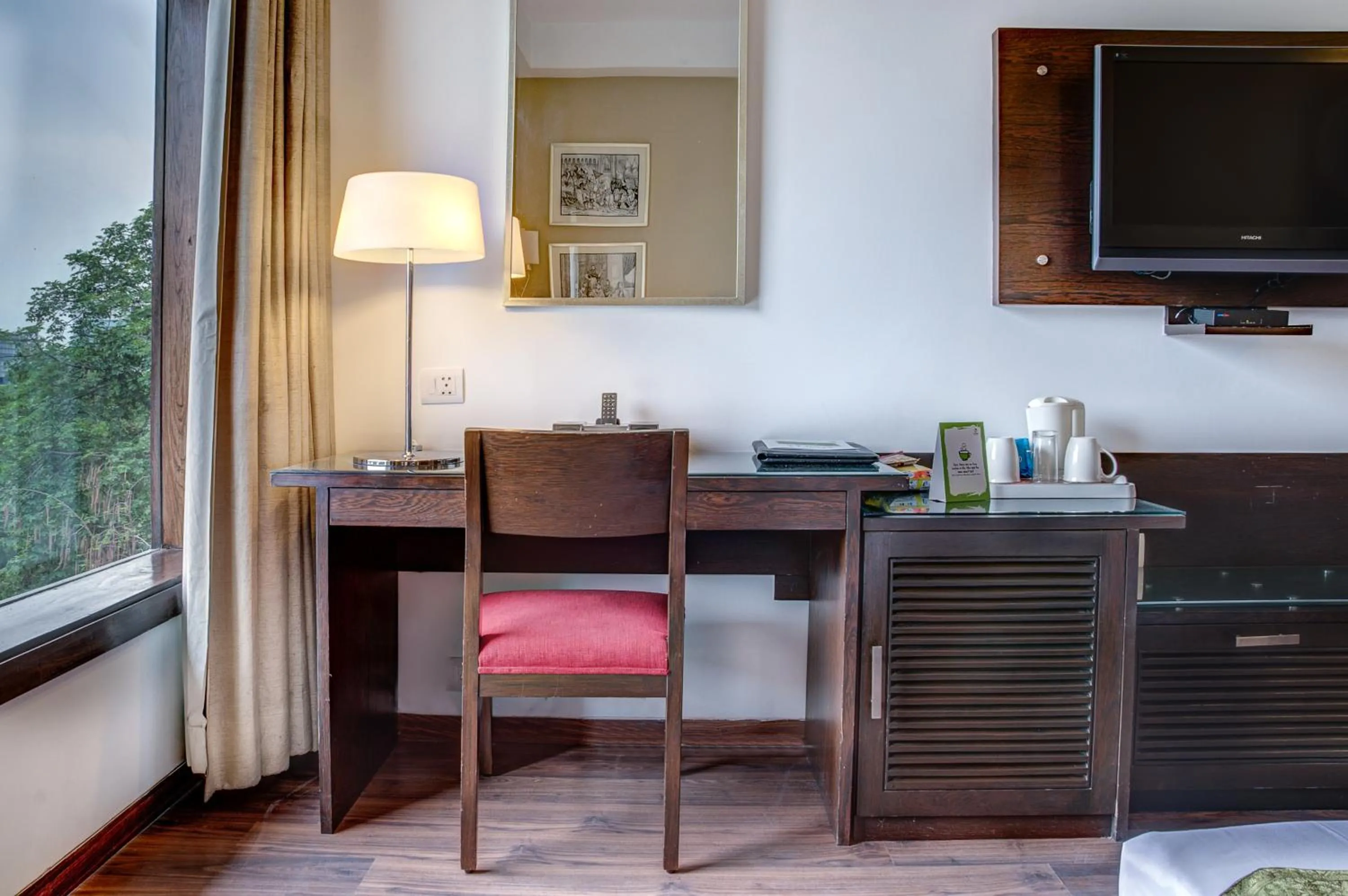 Seating area in Amber Inn by Orion Hotels