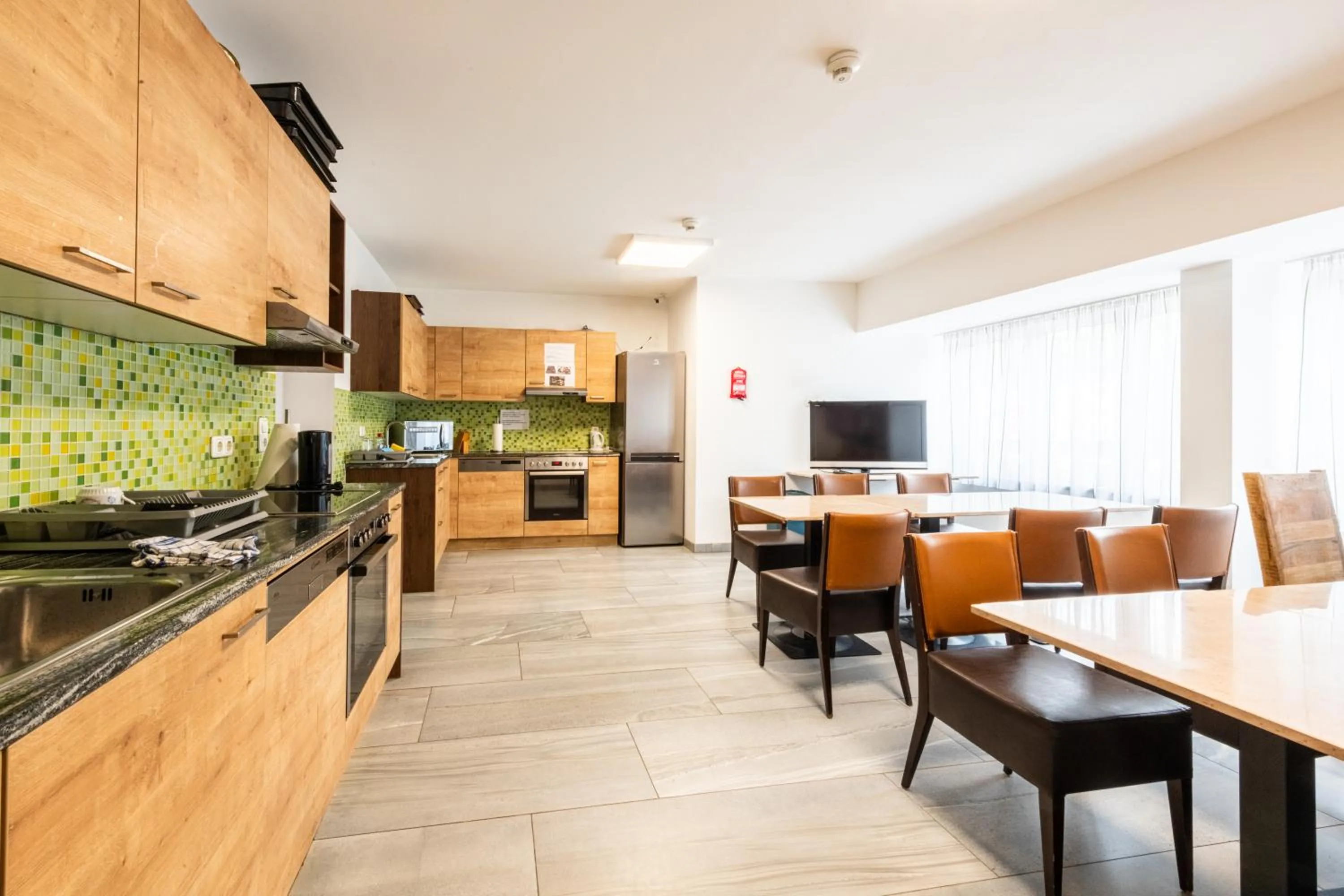 Communal lounge/ TV room in Wels Inn Hotel