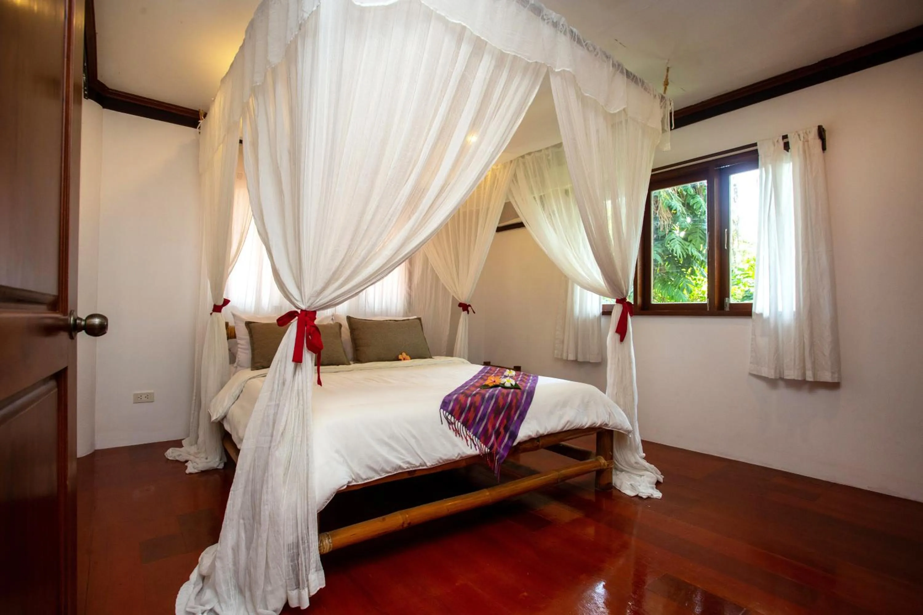 Bed in Mandala Spa & Resort Villas