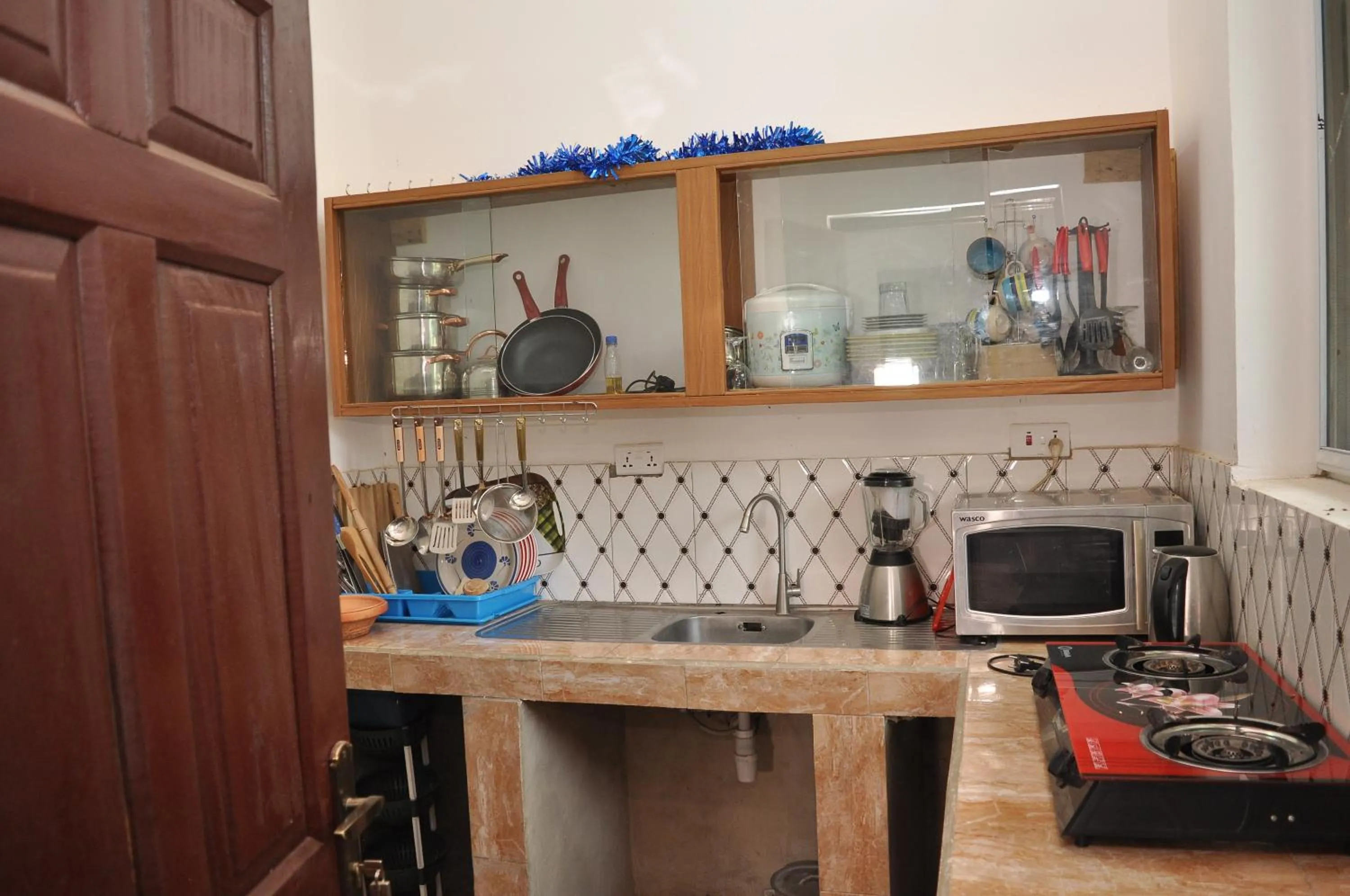 Kitchen or kitchenette in BB Tributary Hotel