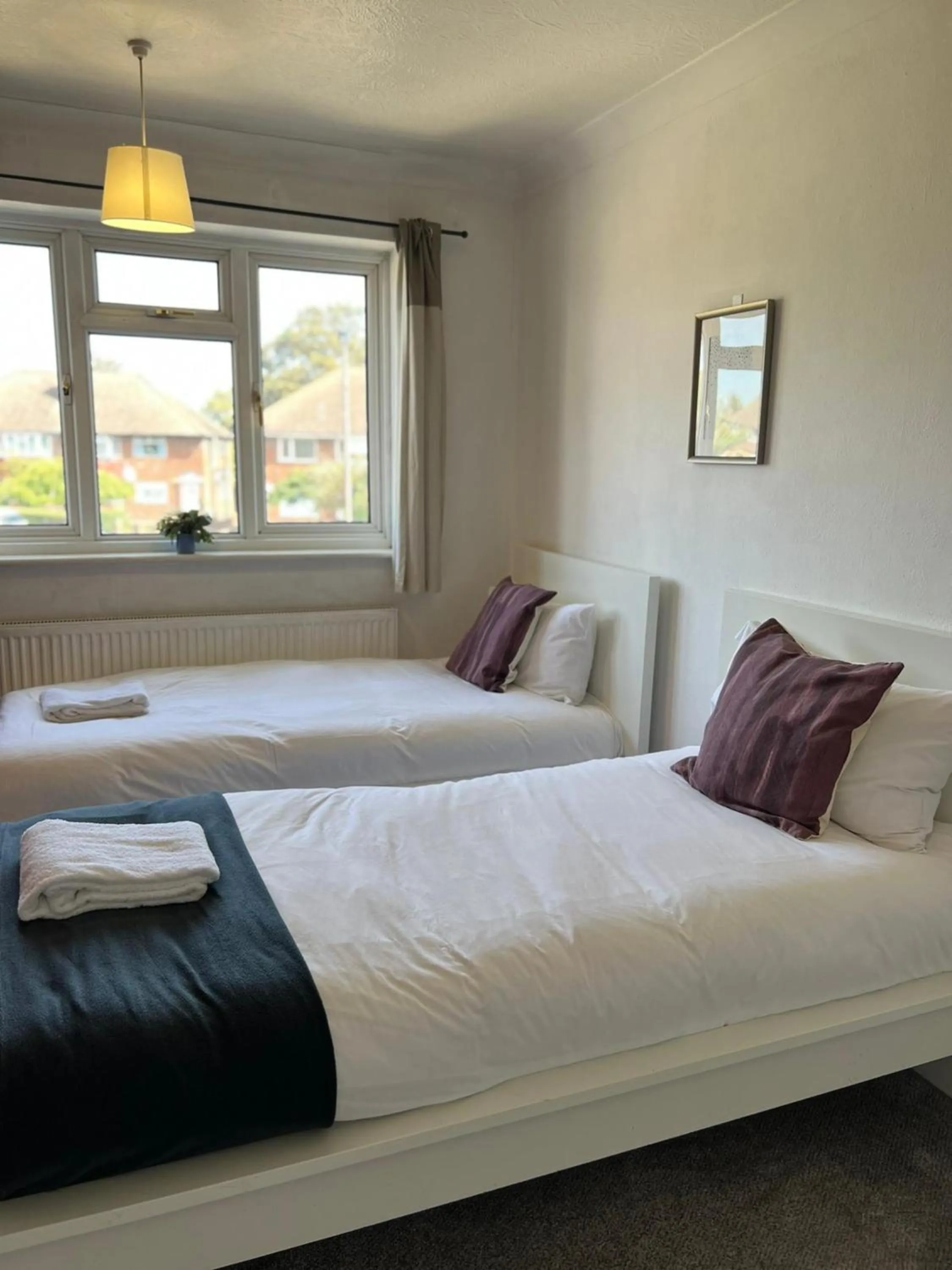 Bed in Airport Garden Rooms