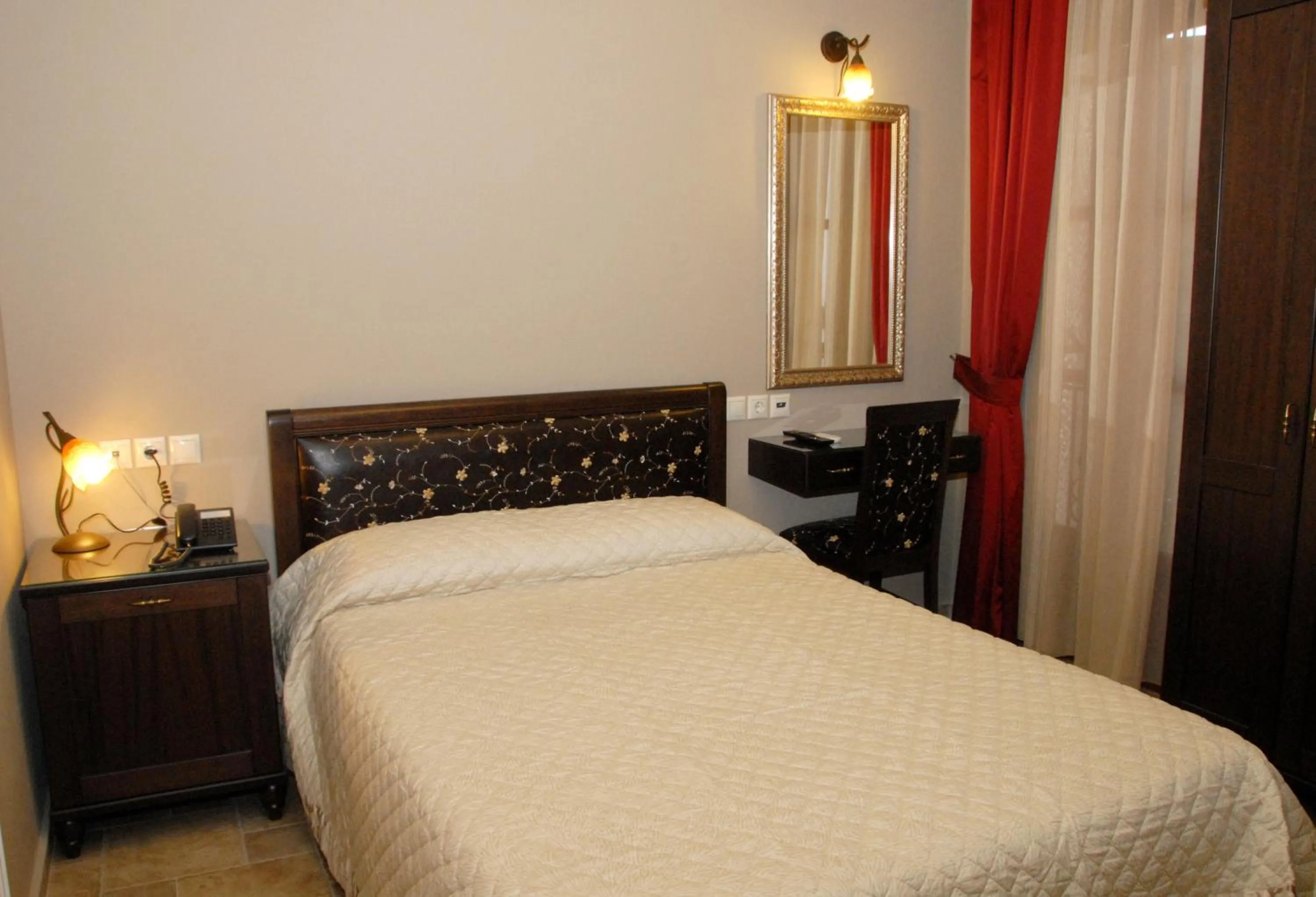 Bed in Hotel Filoxenia