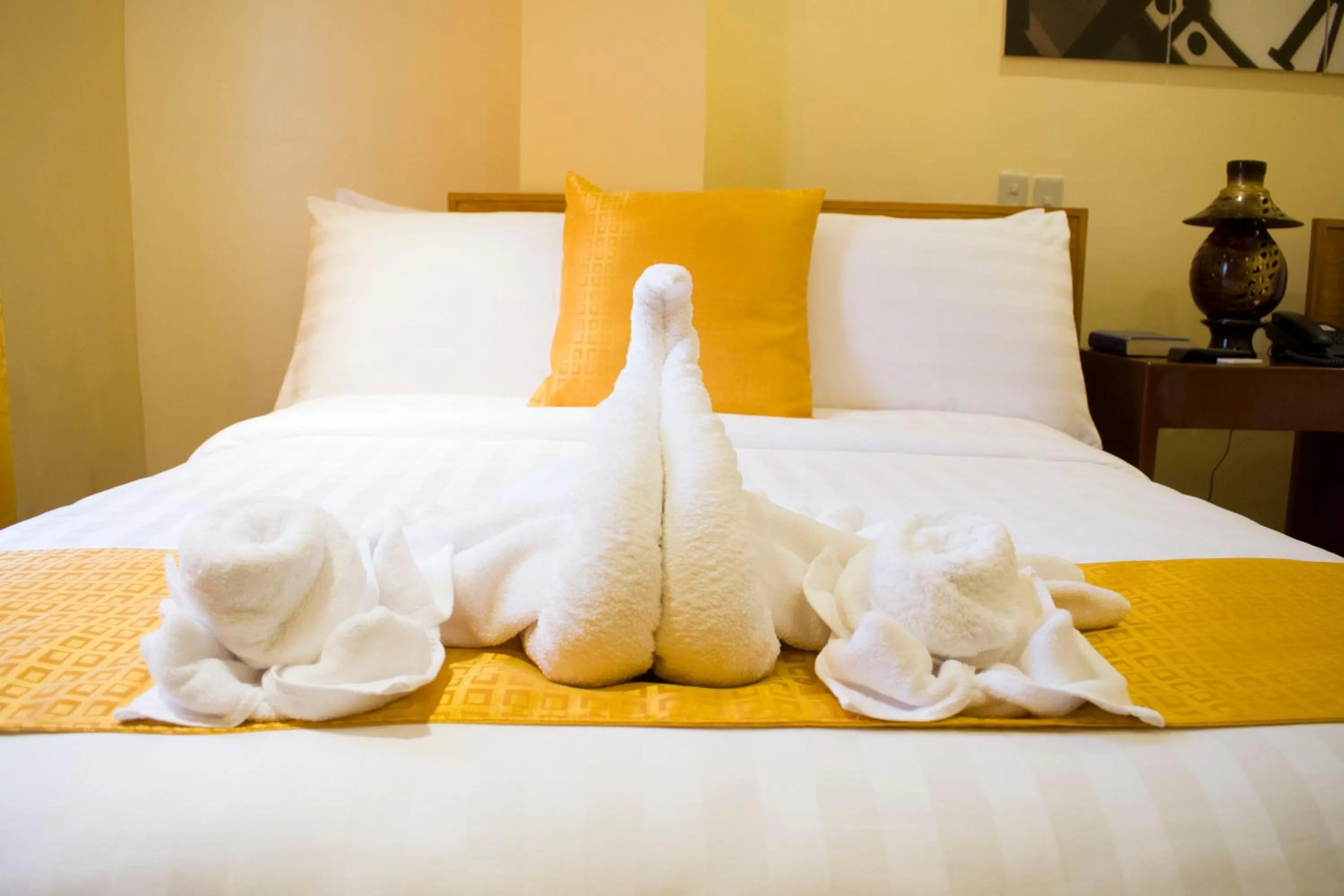 Bed in Royal Mansion Hotel