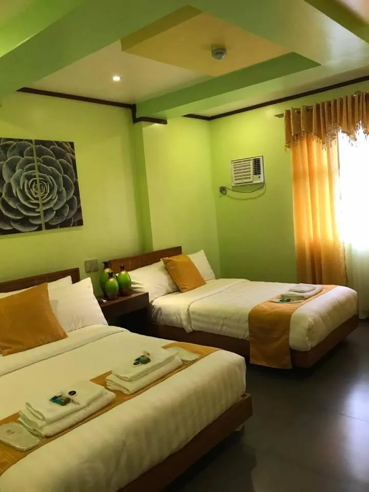 Bed in Royal Mansion Hotel