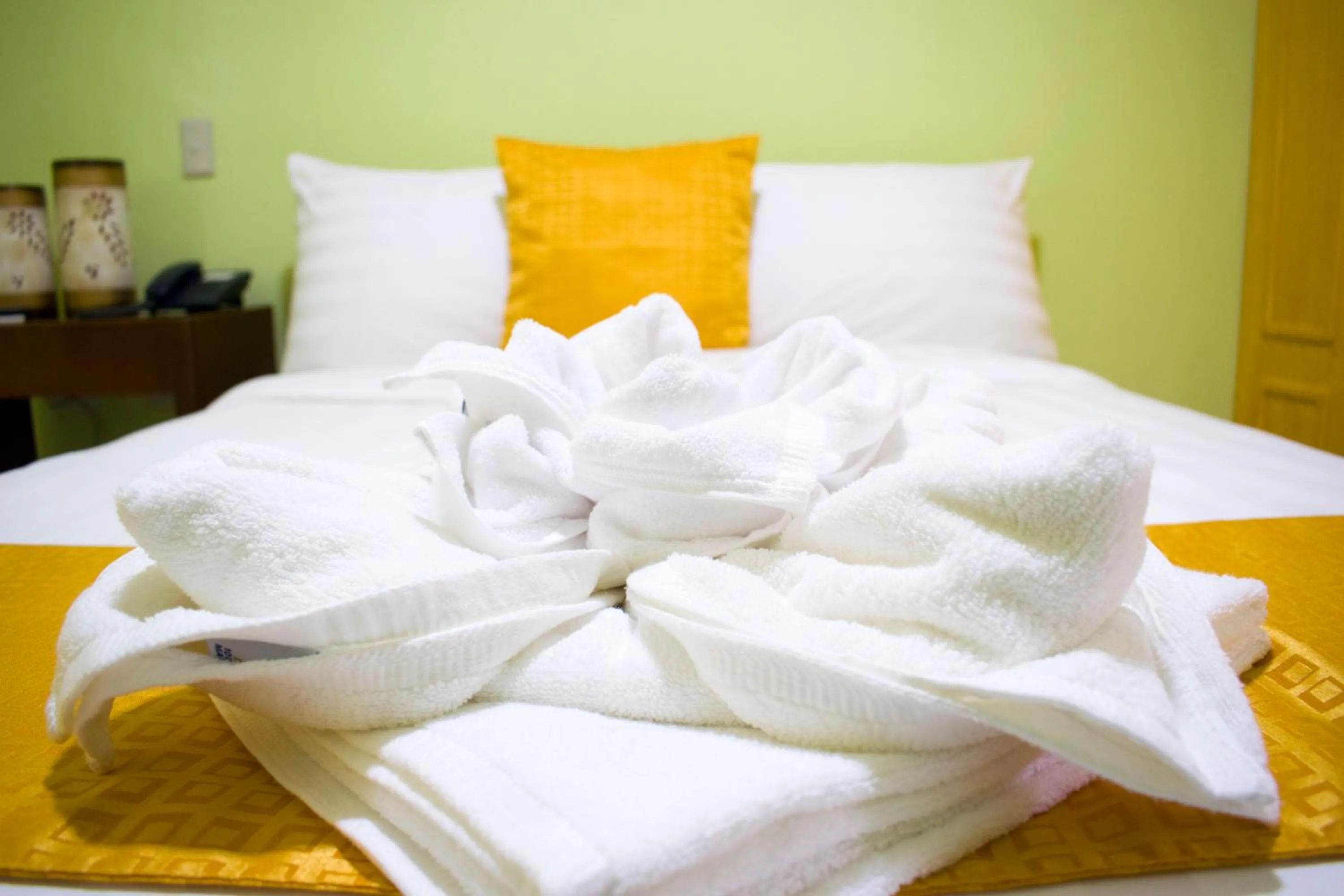 Bed in Royal Mansion Hotel