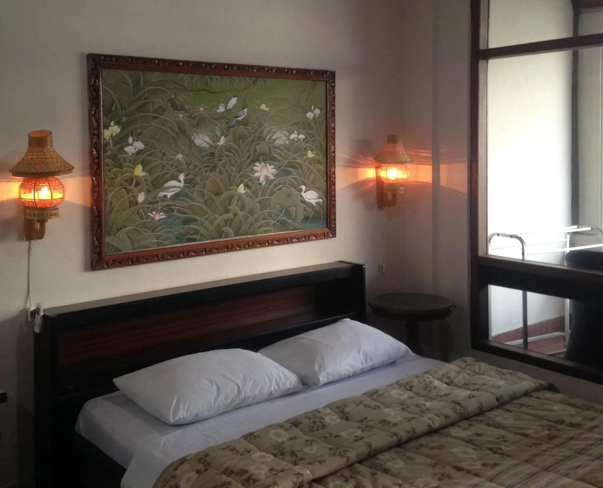 Photo of the whole room, Bed in Dewa Bharata Bungalows Candidasa