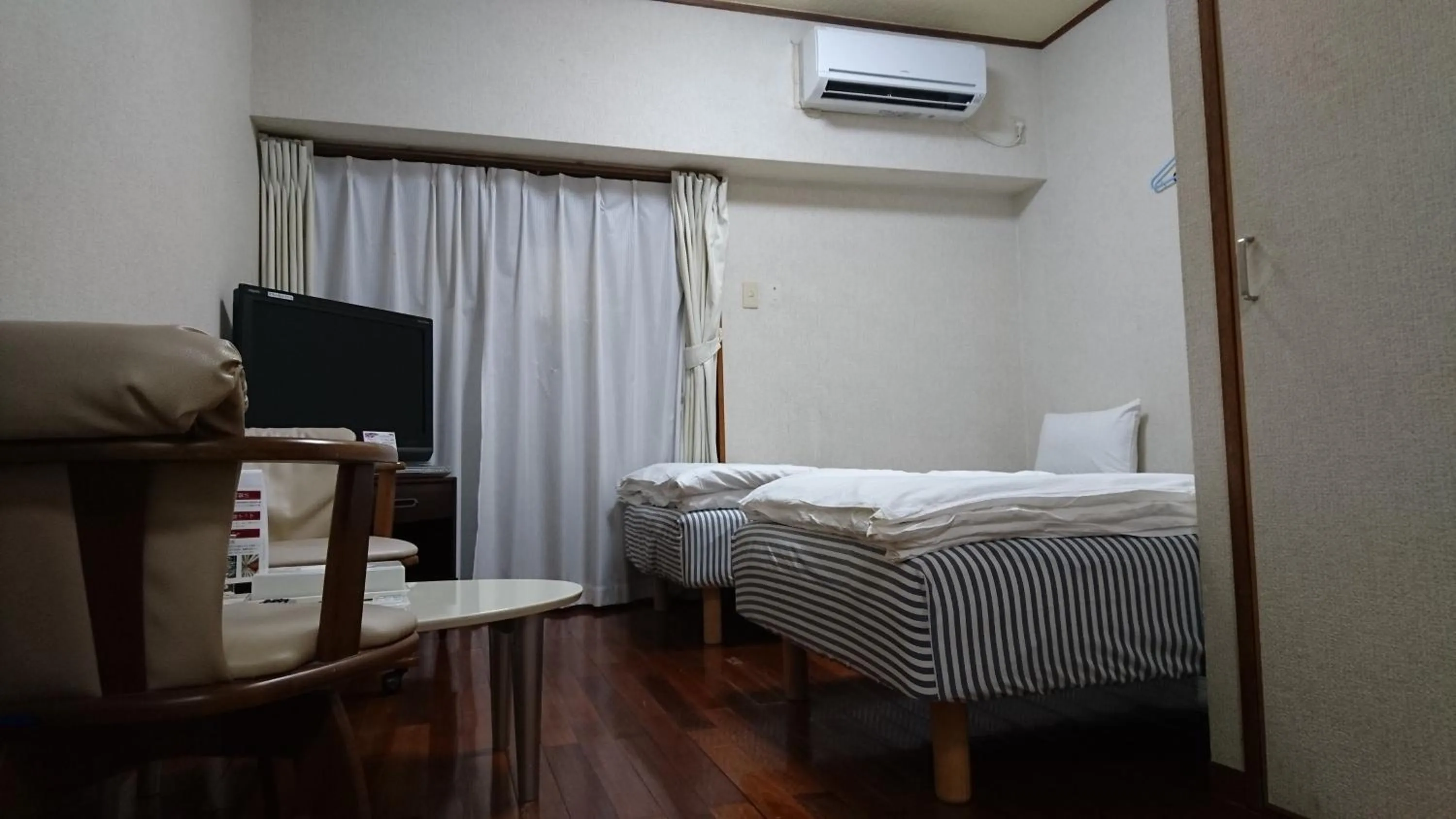 Bed in Kokusai Towns Inn